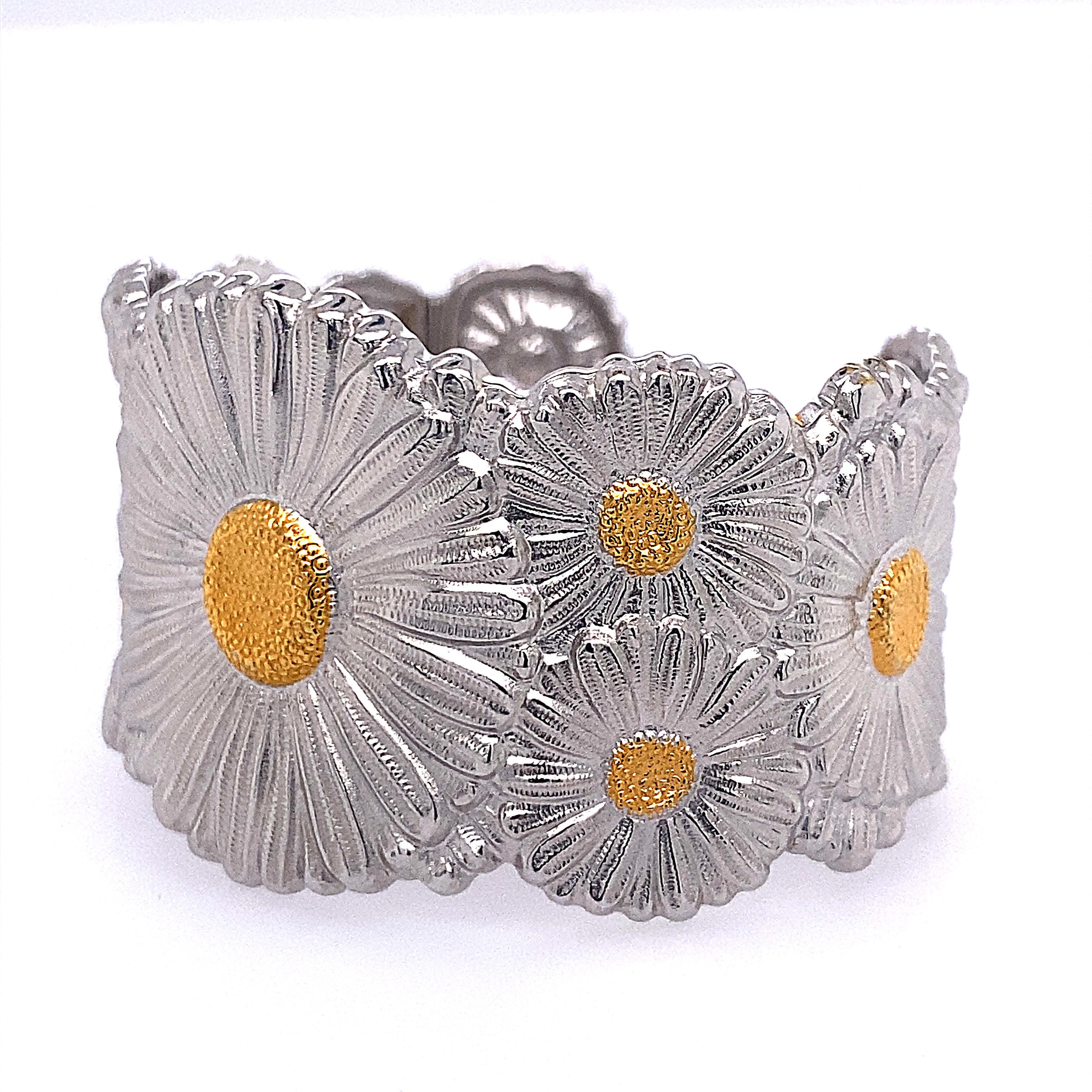 18k yellow gold and sterling silver wide cuff bracelet by Buccellati, depicting Daisy flowers. Will fit approx. 7