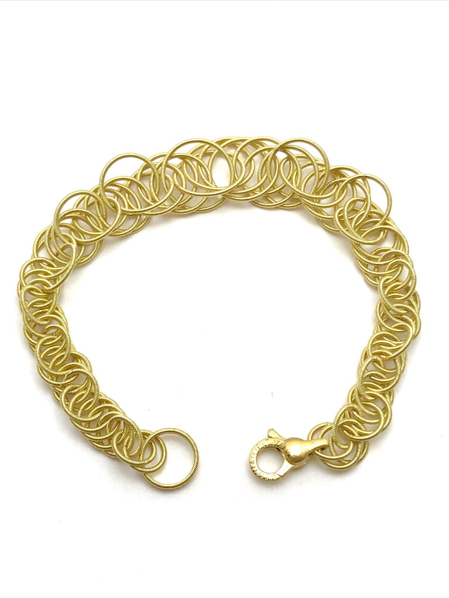 Buccellati's Hawaii bracelet has been one of the house's best-loved styles since the '30s. Each embossed 18-karat gold hoop is linked by hand so it doesn't tangle, and even the discreet lobster clasp has the same Rigato engraving.  The Buccellati