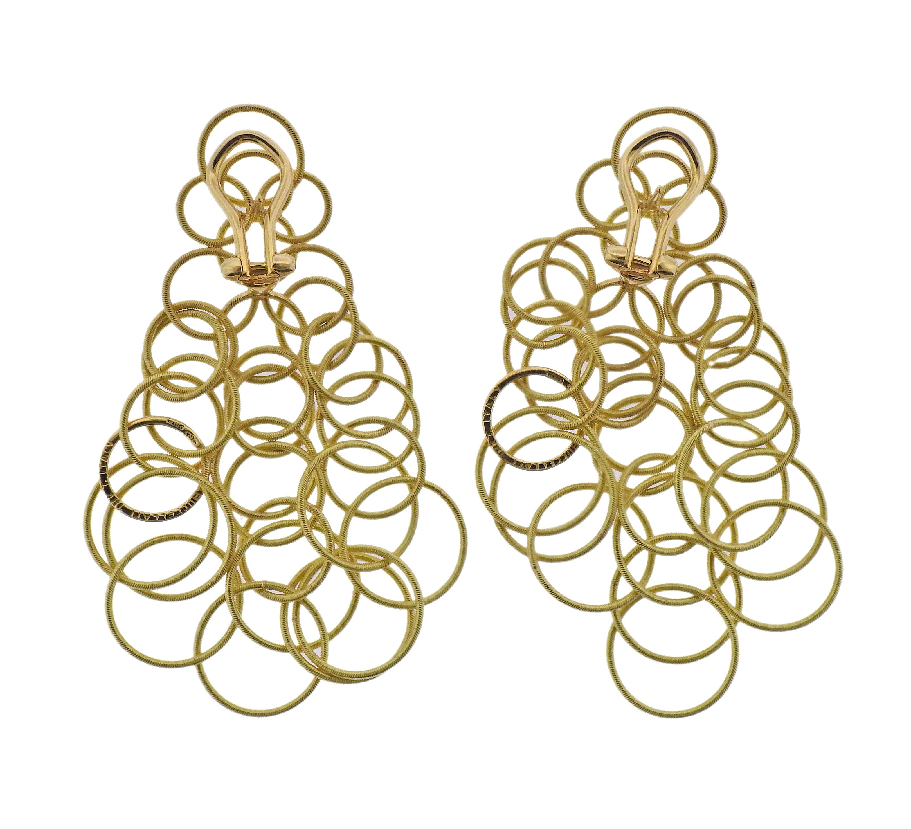 Pair of 18k yellow gold Hawaii earrings by Buccellati. Earrings are 2 5/8