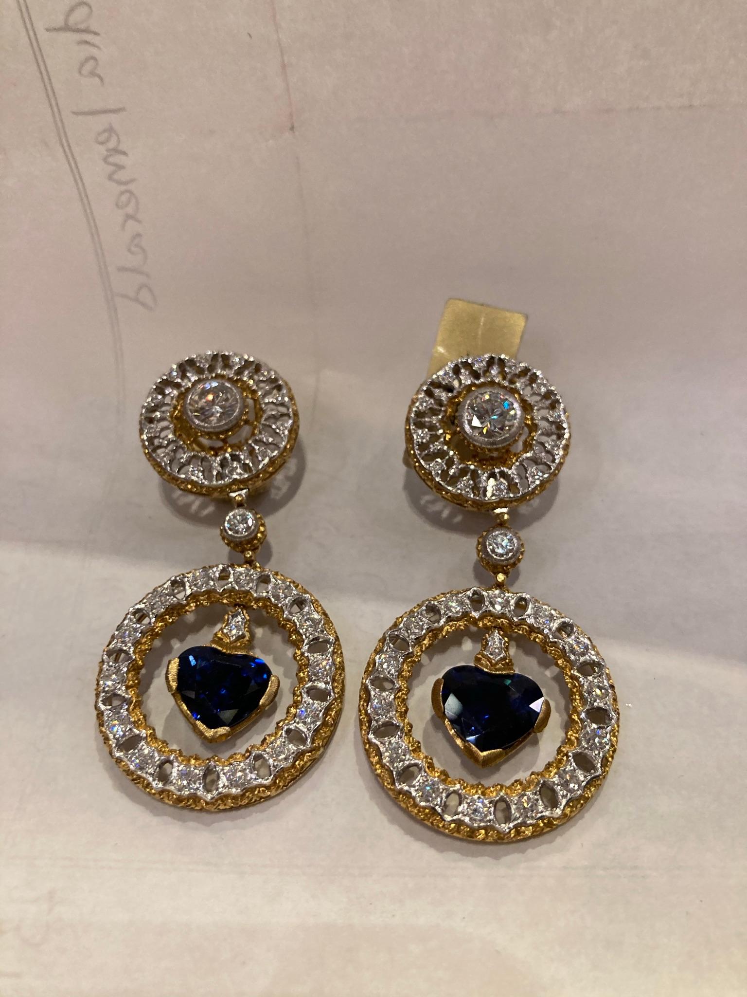 A sumptuous pair of Buccellati earrings, showcasing 5.50 carats of heart shaped sapphires and diamonds. Made in Italy, circa 1970


