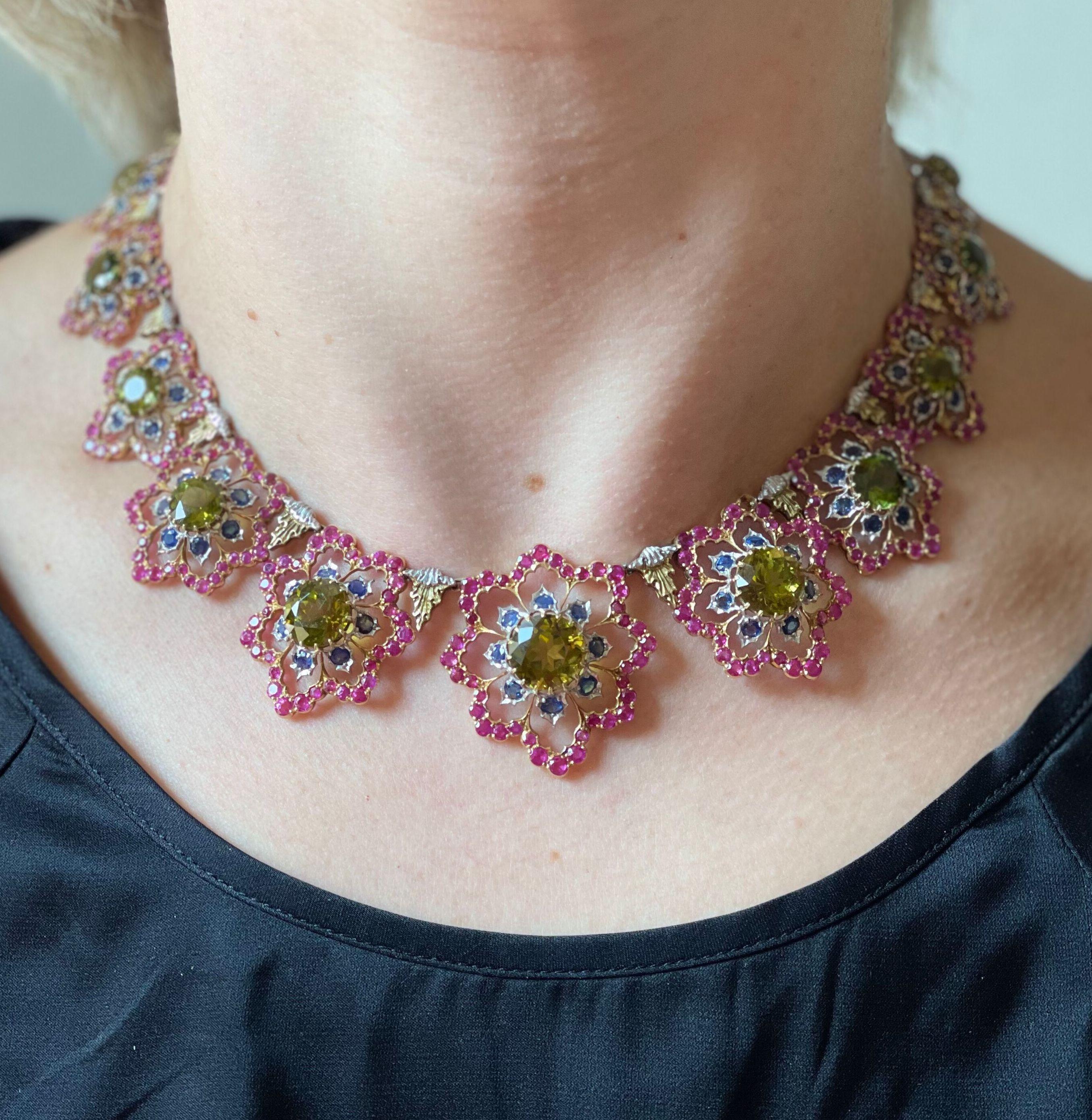 Important and impressive 18k gold necklace by Buccellati, adorned with vibrant rubies, blue sapphires and deep yellowish green peridots. The necklace is 16