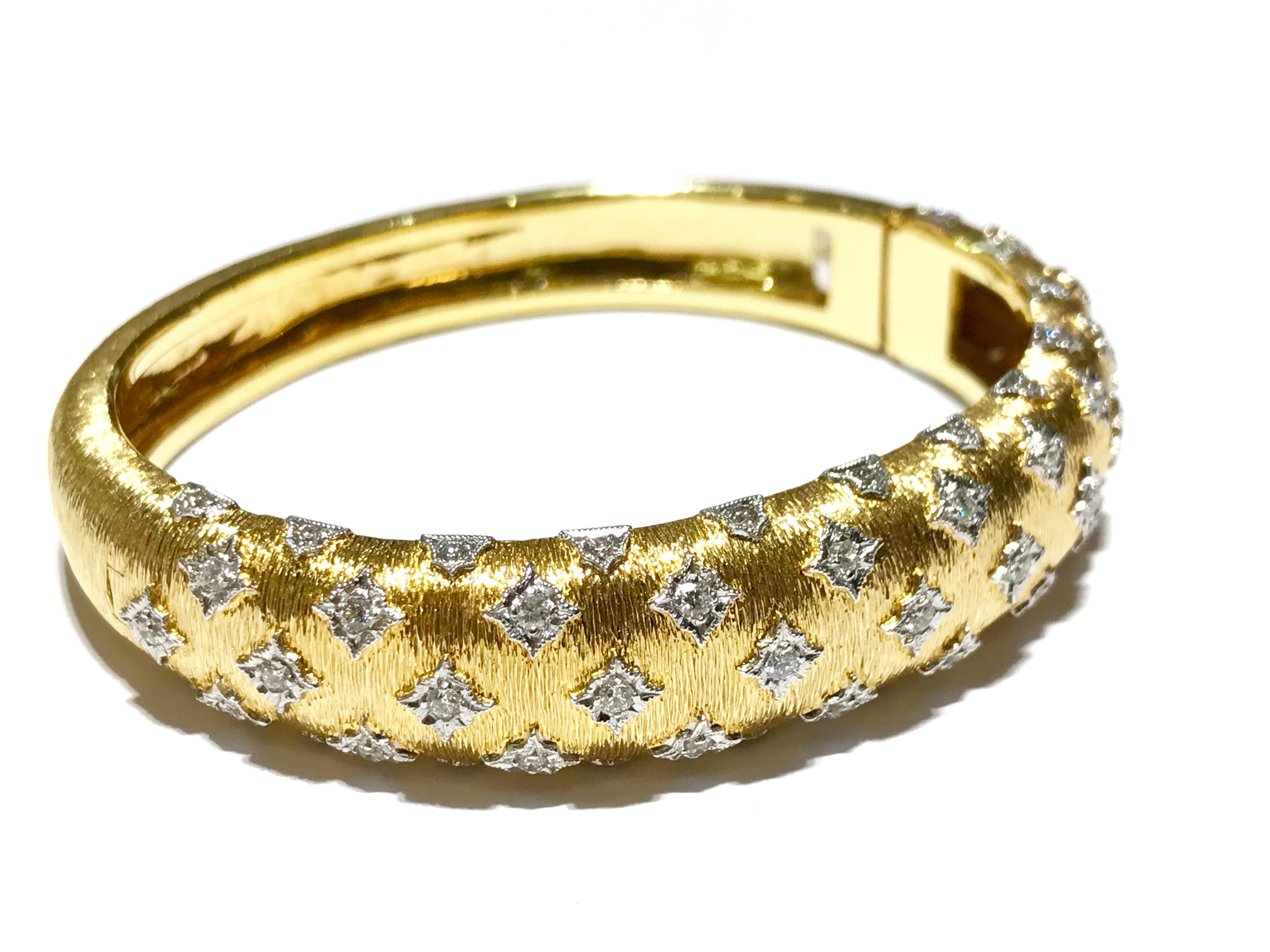 Custom design bracelet in y/g with white gold bezels set with diamonds
58 round shaped diamonds 1.09 carat VS clarity F colour 
two tone brushed finish gold 
