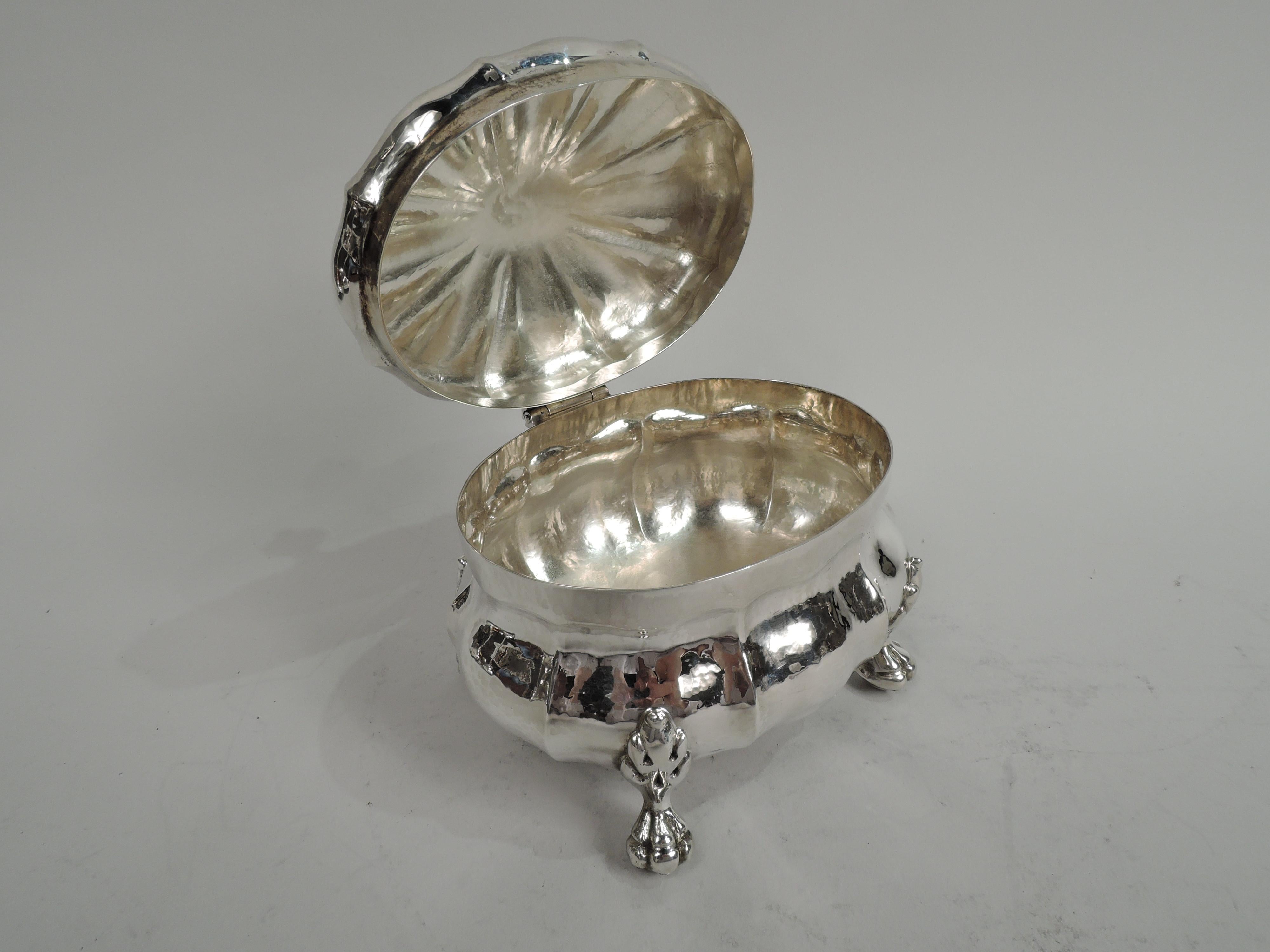Modern Classical sterling silver box. Made by Buccellati in Italy. Lobed and bellied ovoid bowl. Cover hinged with radiating flutes and vasiform finial. Four leaf-mounted paw supports. Marked “Italy Buccellati Sterling”. Weight: 11.8 troy ounces.