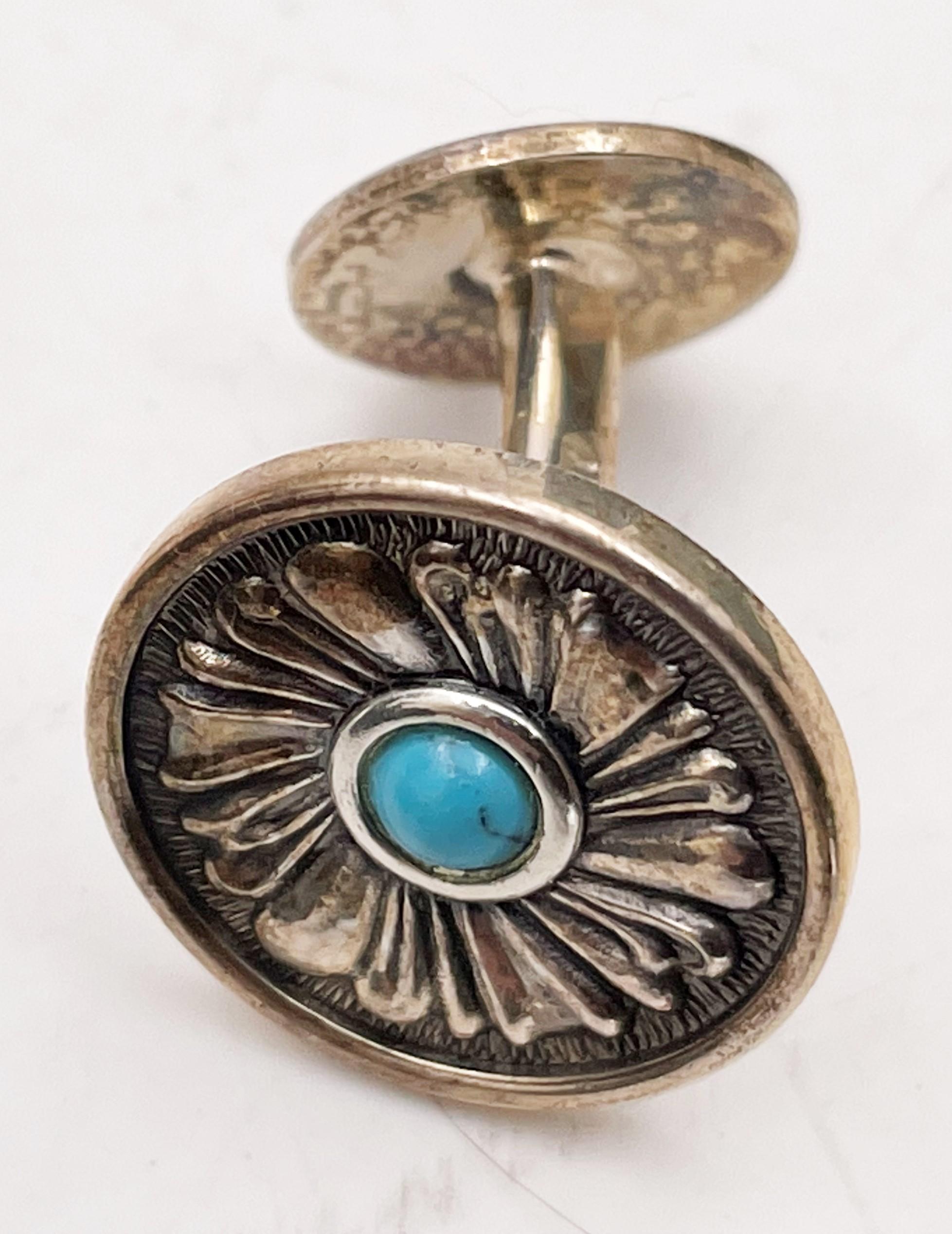 Gianmaria Buccellati, Italian, pair of sterling silver cufflinks with turquoise at the center, in a beautiful floral motif, measuring 2/3'' in diameter, and bearing hallmarks. Sold in its original box, never used. 

Mario Buccellati, the founder