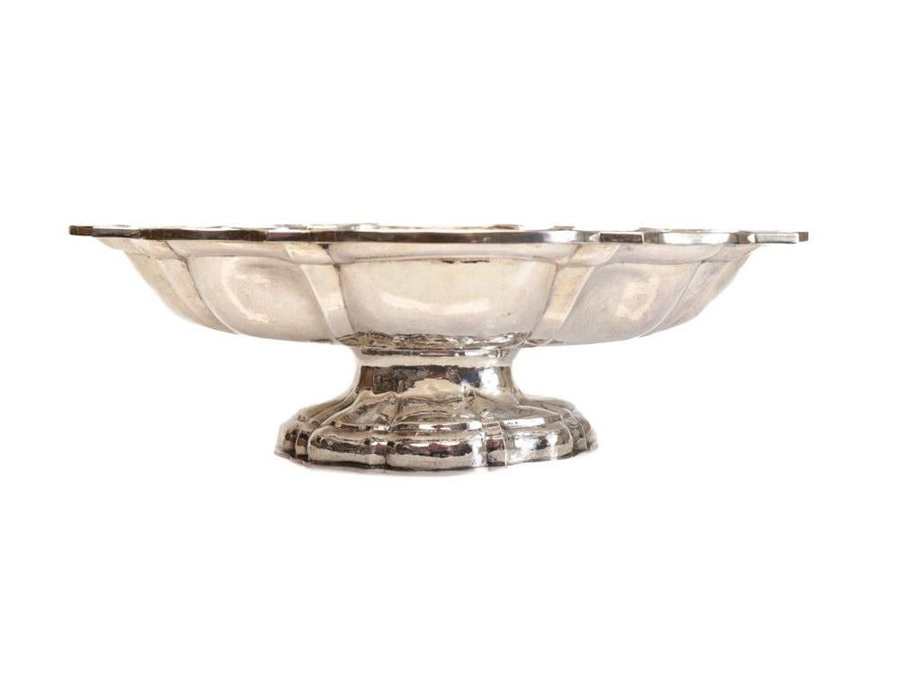 Vitali Bruno Italian sterling silver scallop rimmed footed centrepiece bowl for Buccellati, circa 1950. Hand-hammered throughout. Marked Buccellati to the underside base. Weight Approx., 58.85ozt.



Measures: Approximate, 18.1