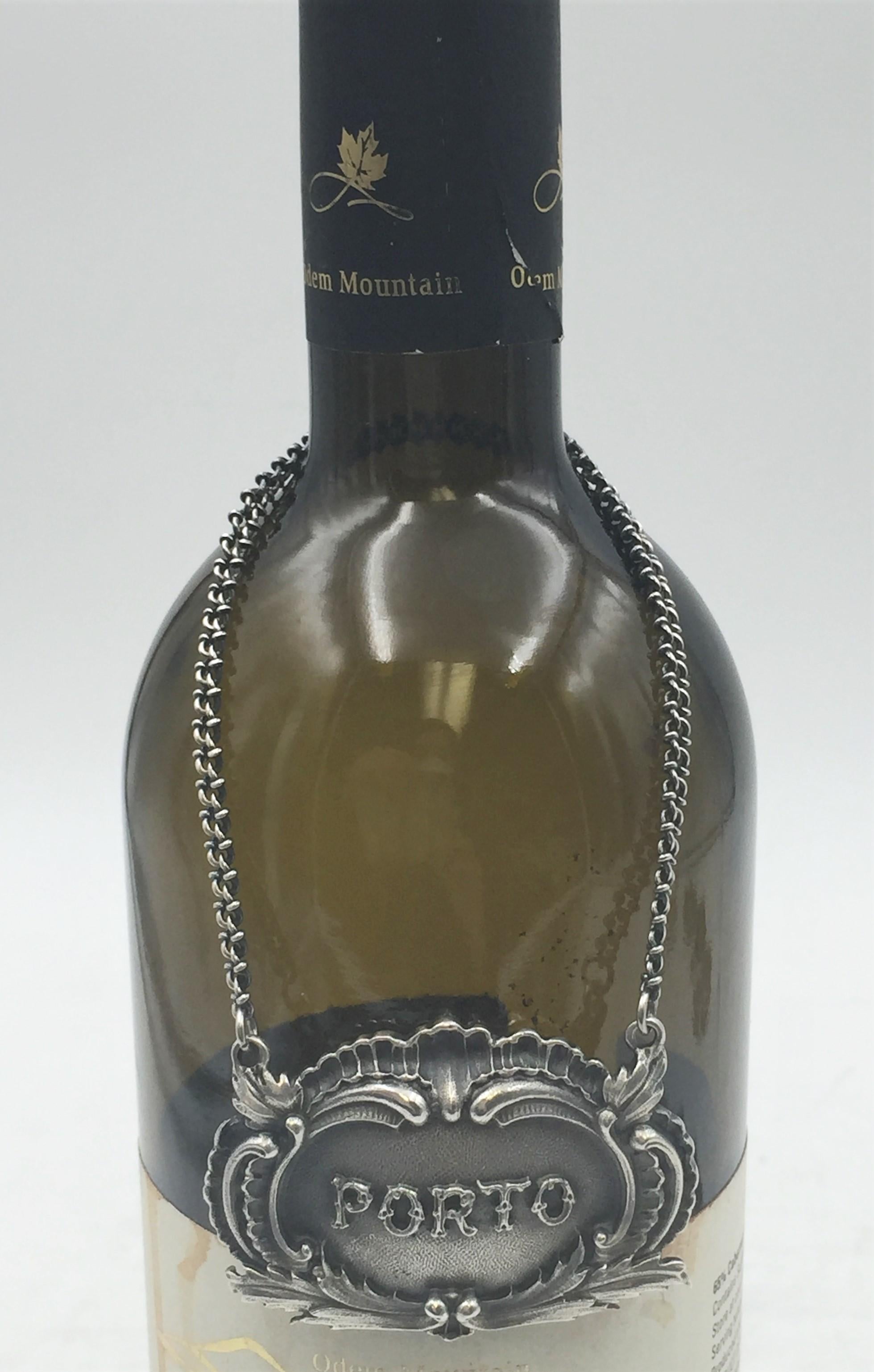 Rare Buccellati sterling silver claret jug bar label. PORTO embossed on the front in the center.

Marks on the back: Gianmaria Buccellati (signature and Italian maker's mark), ITALY, 925 (encircled silver purity mark).

It measures 2.25in x 1.25in.