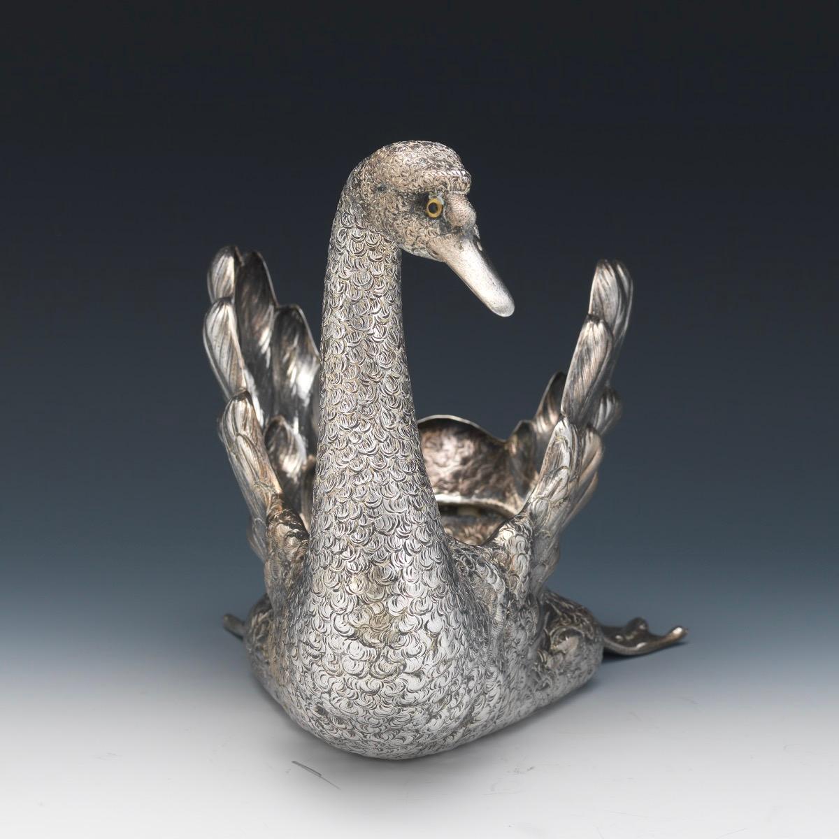 Buccellati Italy, a large sterling silver swan centerpiece 

A large sterling silver swimming swan centerpiece bowl with textured finish, with scrolled neck and head and glass eyes. 

Textured feathers beautifully delineated. Marked Buccellati,