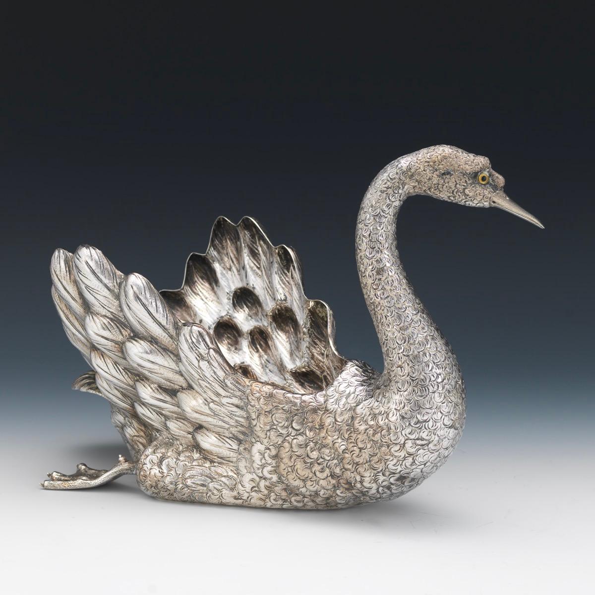 Buccellati Italy, a Large Sterling Silver Swan Centerpiece.

A large sterling silver swimming swan centerpiece bowl with textured finish, with scrolled neck and head and glass eyes.

Textured feathers beautifully delineated. Marked Buccellati,