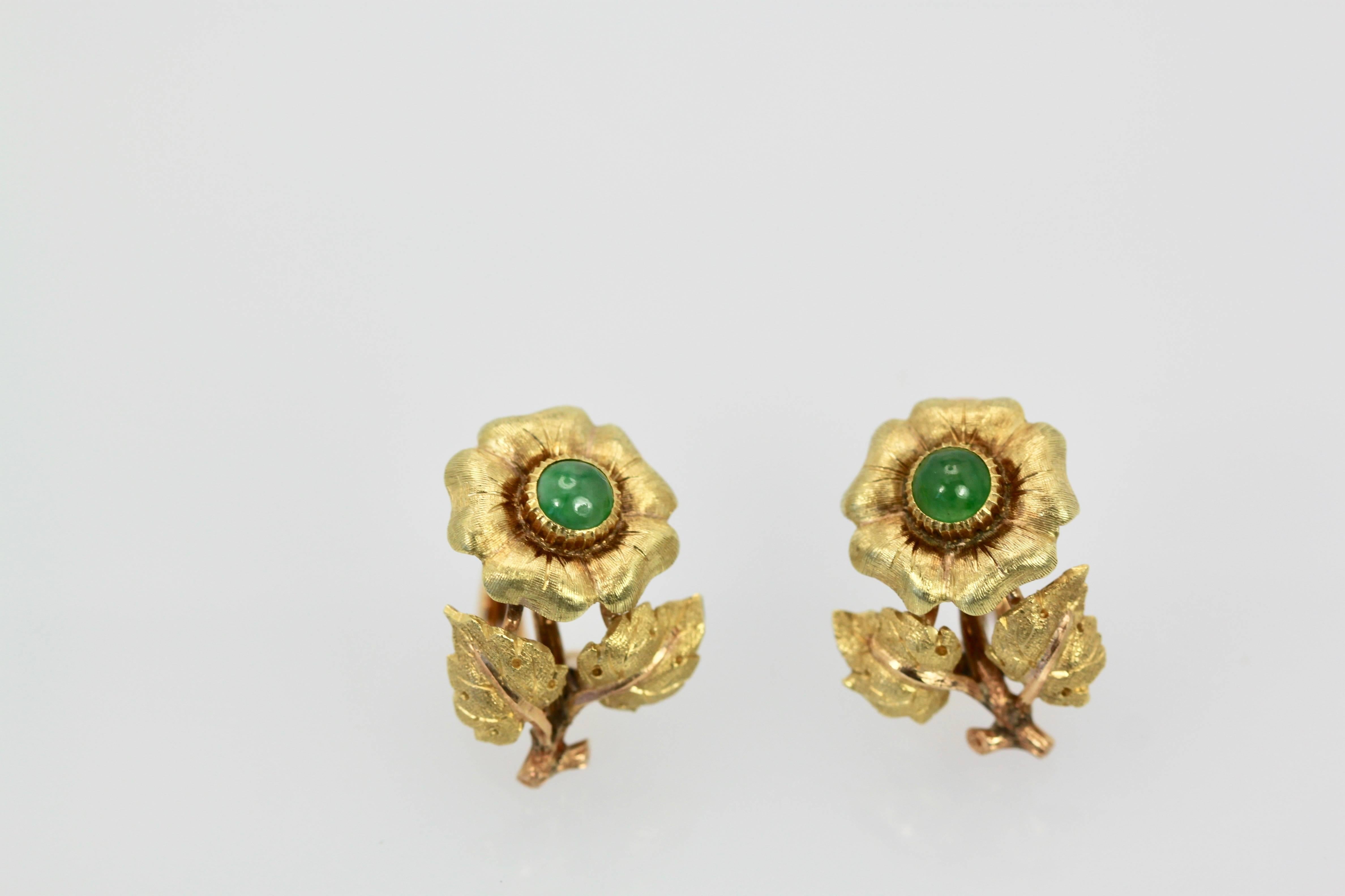 These earrings were made by Mario Buccellati as marked on the piece.  These are from the 1960's and are in excellent shape.  These earrings are set with cabochon Jade stones at approximately 0.50 carats each in the center of the flower.  This has