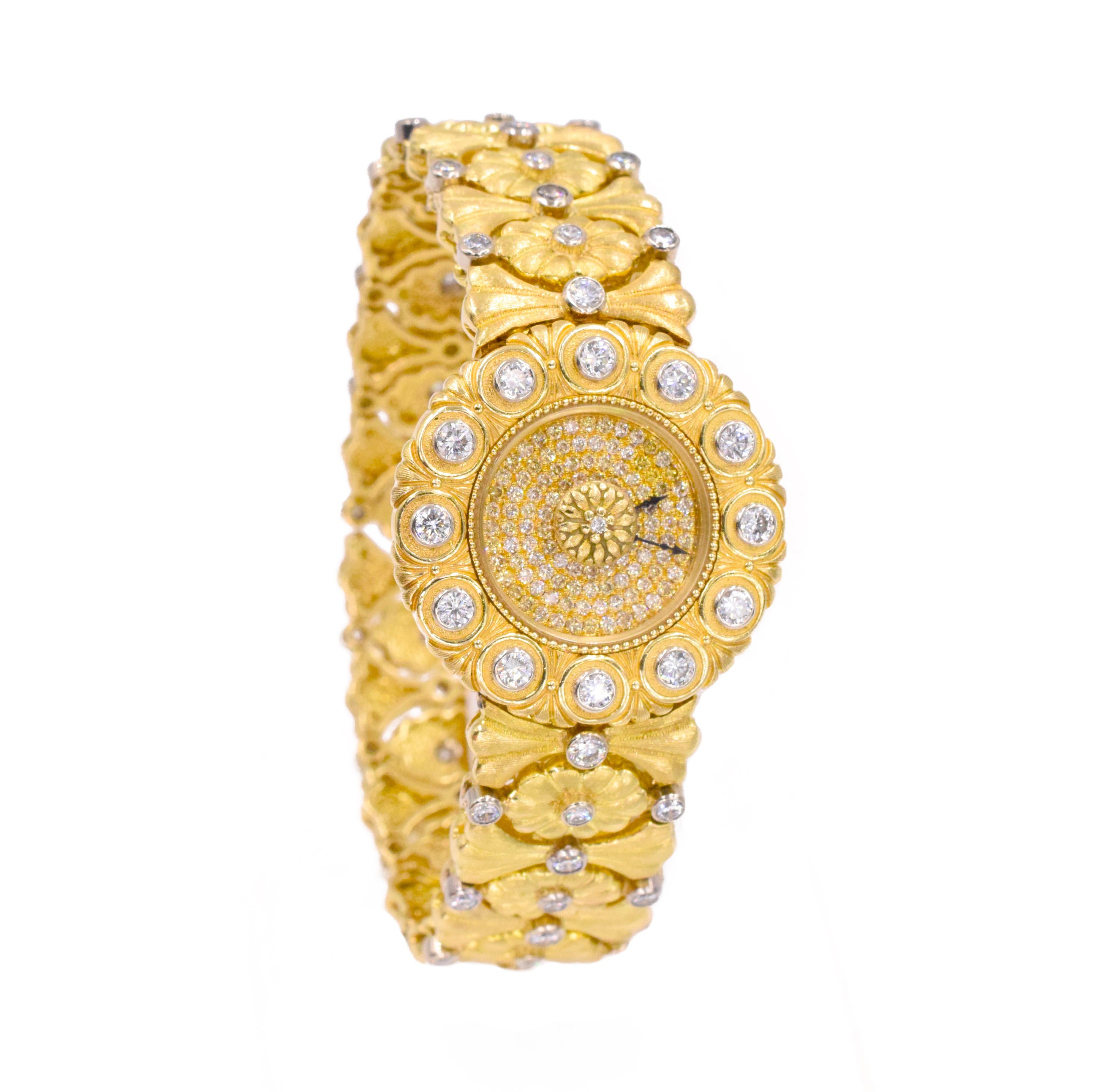 Buccellati Gold and Diamond Watch. This watch has diamonds with a total carat weight of XXct set in 18k yellow gold with a floral design. 
Signed: Gianmaria Buccellati, Eliochron Jeweled, Italy
Buccellati Watch Box. 