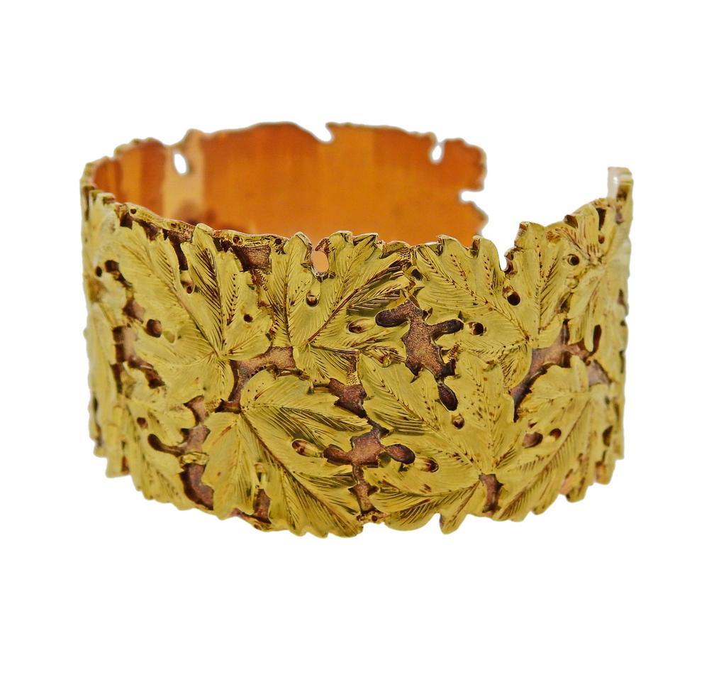 18k yellow gold leaf motif cuff bracelet by Buccellati. Bracelet will fit approx. 7.25