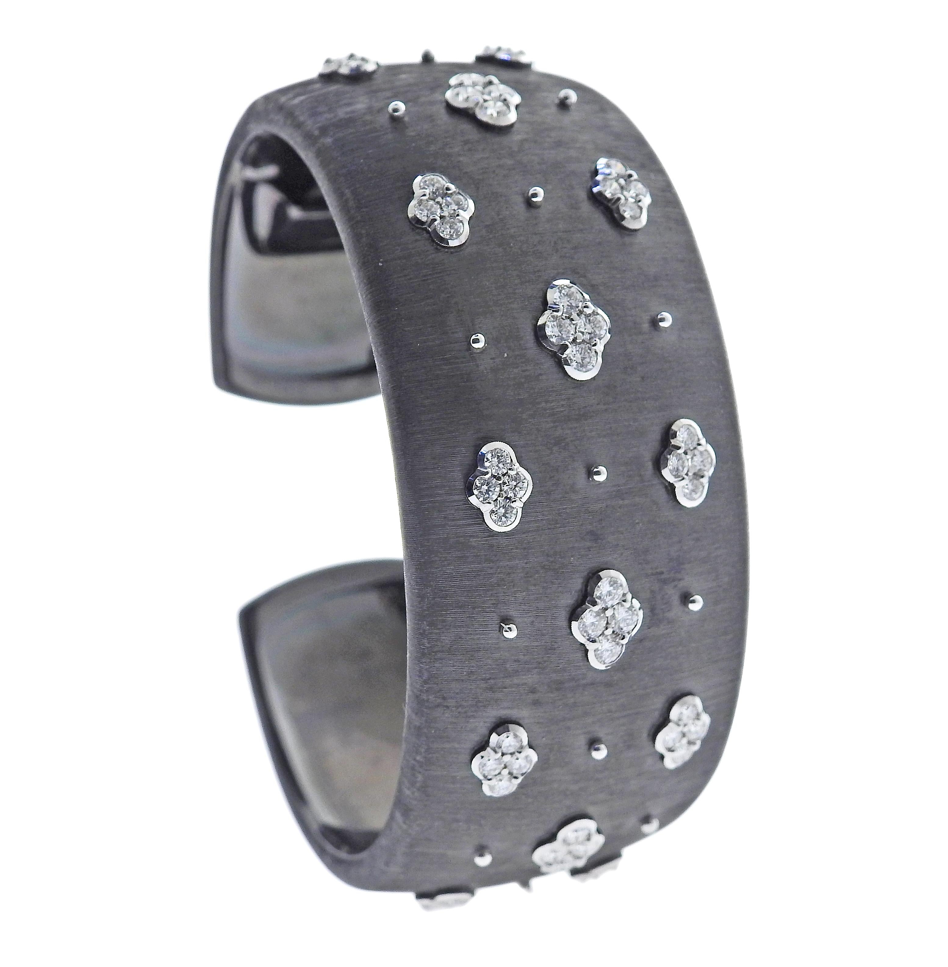 Classic 18k blackened gold cuff bracelet by Buccellati, with approx. 1.60ctw H/VS-SI diamonds. Bracelet will fit Approx. 6