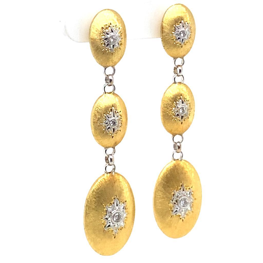 A pair of Buccellati 'Macri Classica' diamond set 18 karat yellow gold earrings

Buccellati incorporates Renaissance artisanal aesthetics into these statement drop earrings. Incorporating satin textured 18 karat yellow gold to great effect this