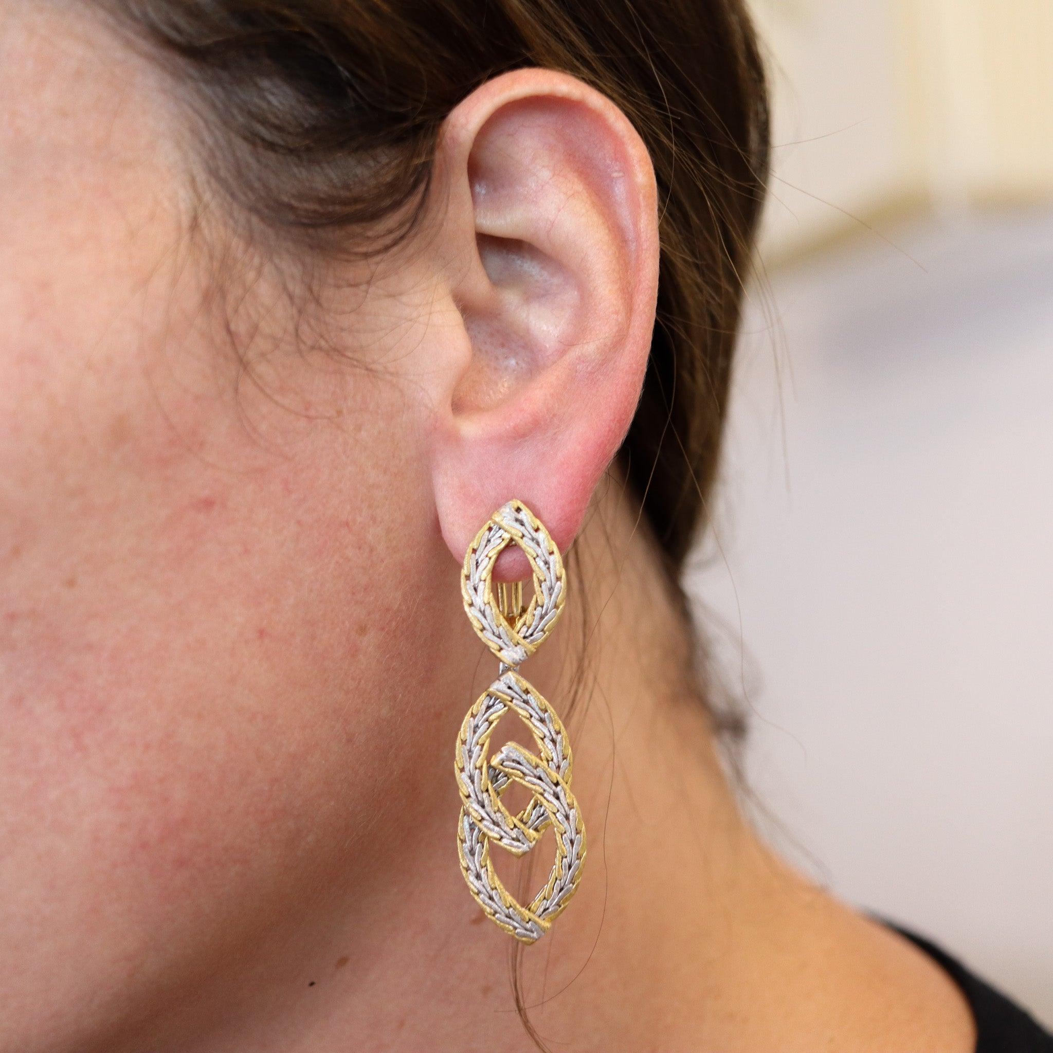 Dangle drop earrings designed by Mario Buccellati.

Fantastic pair of dangles drop earrings, created in Milano Italy by the jewelry house of Buccellati. These earrings were carefully crafted in solid yellow and white gold of 18 karat. The woven gold