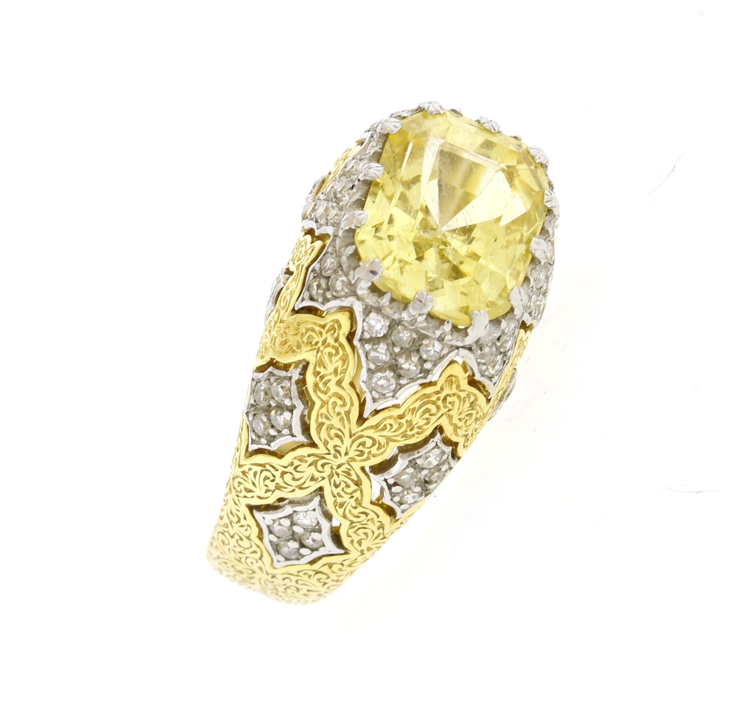 From  Italian jewelry house Buccellati, this very special certified natural yellow emerald cut sapphire and diamond hand engraved ring 
• Designer: Buccellati
• Metal: 18 karat yellow and white gold
• Circa: 1980s
• Size: 6 ½ with interior butterfly