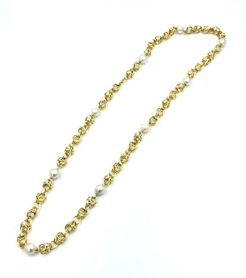 An elegant and easy to wear  Buccellati solid gold three-dimensional circle link and pearl necklace. Nine pearls alternate with nine 3.25” gold link sections. Not your traditional Buccellati design.  