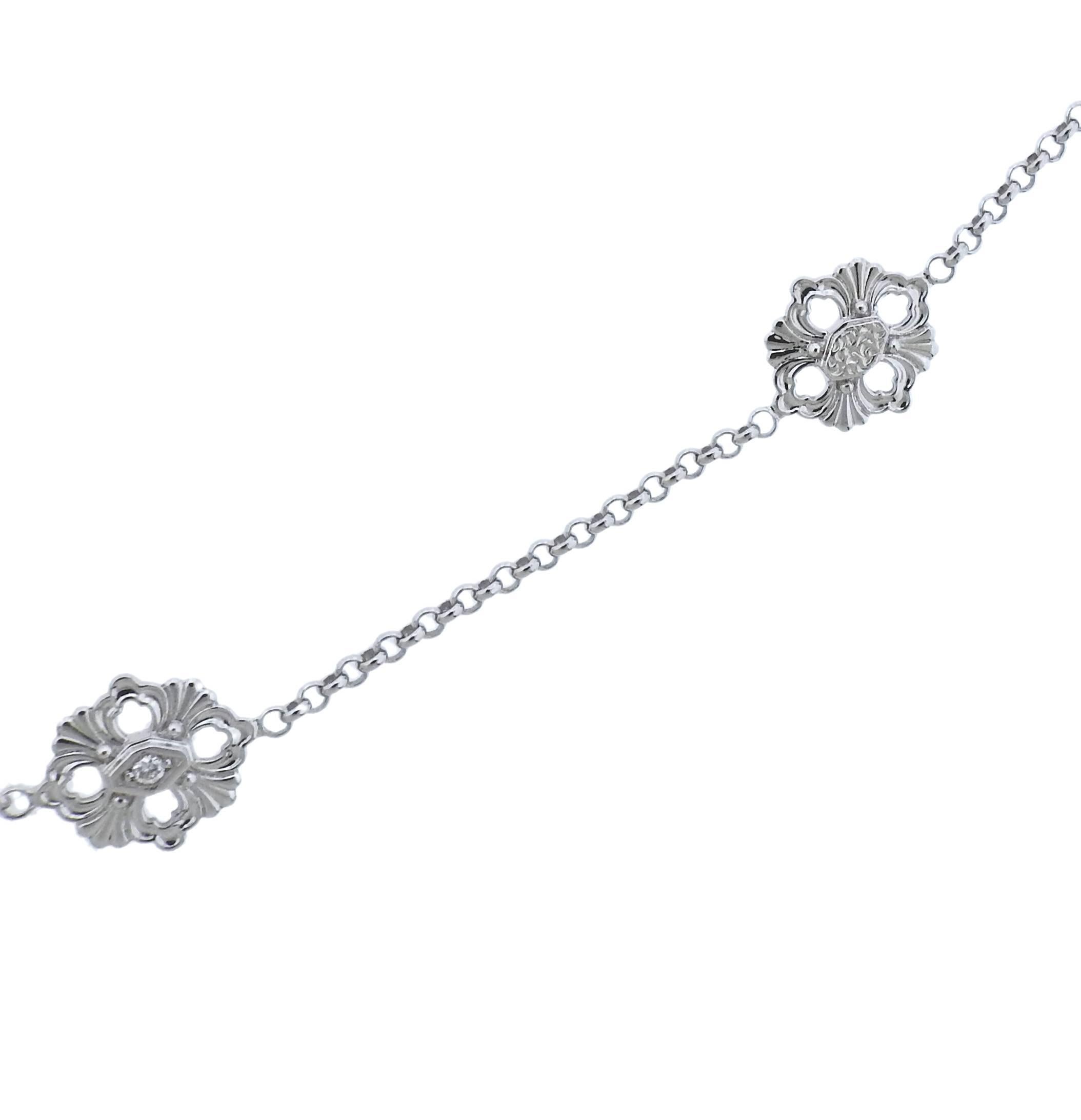 18k white gold station necklace crafted by Buccellati. Necklace measures 35.5