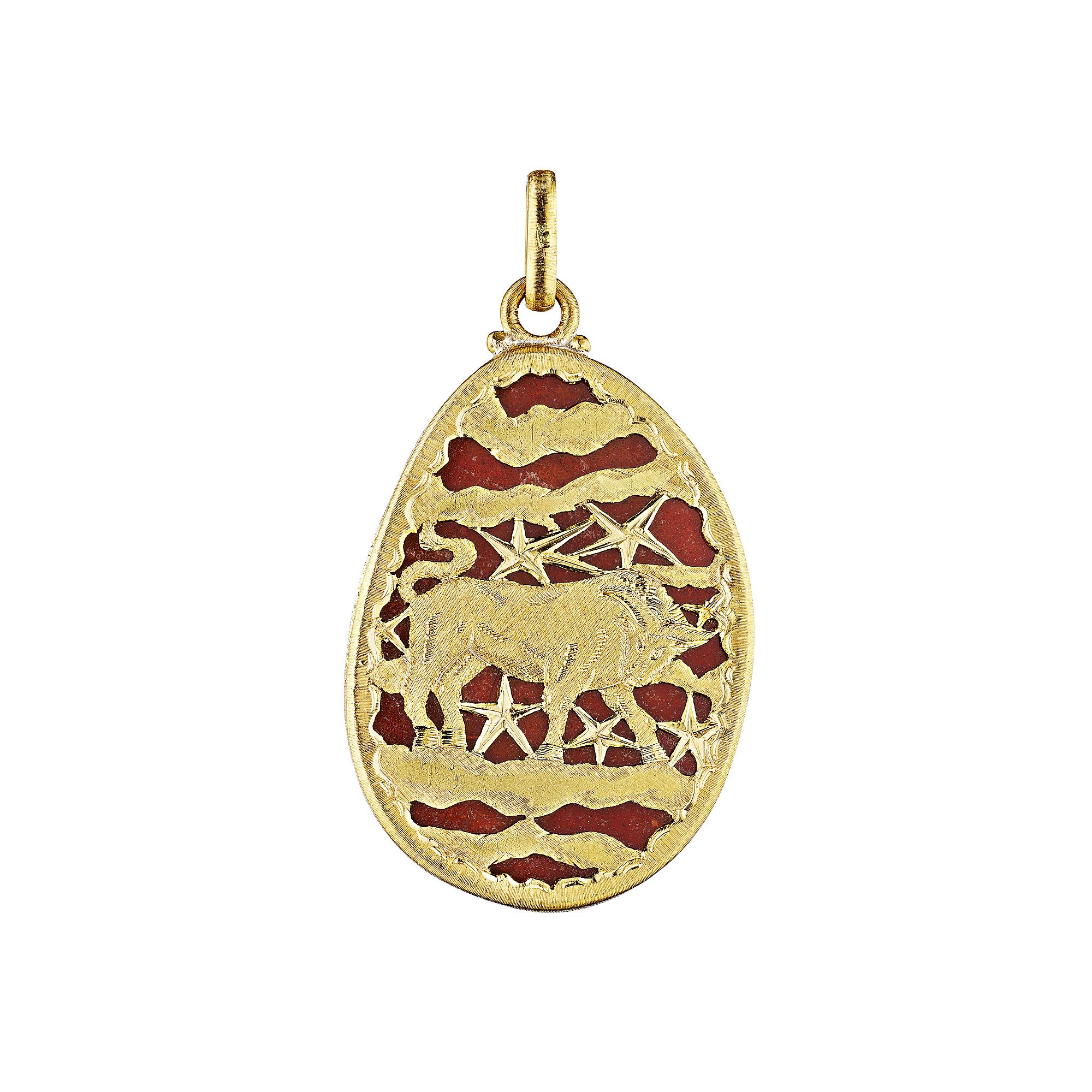 Forged in nature.  Carved from mother earth, this oval cut agate gemstone vintage Buccellati  pendant is beautifully highlighted with an 18 karat yellow gold hand engraved Taurus zodiac designed back.  Signed Mario Buccellati.  Circa 1970's.  2
