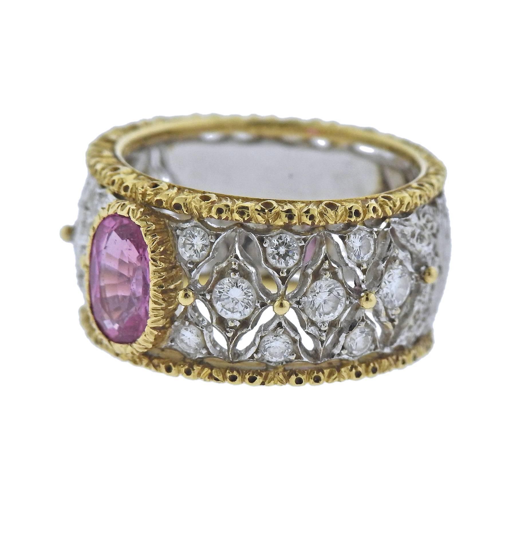 18k white and yellow gold band ring, crafted by Buccellati, featuring approx. 0.91ct oval pink sapphire, adorned with approx. 0.68ctw in H/VS diamonds. Ring size - 5.75, ring is 10.5mm wide, weighs 7.5 grams. Marked: Buccellati, Italy, 18k.
