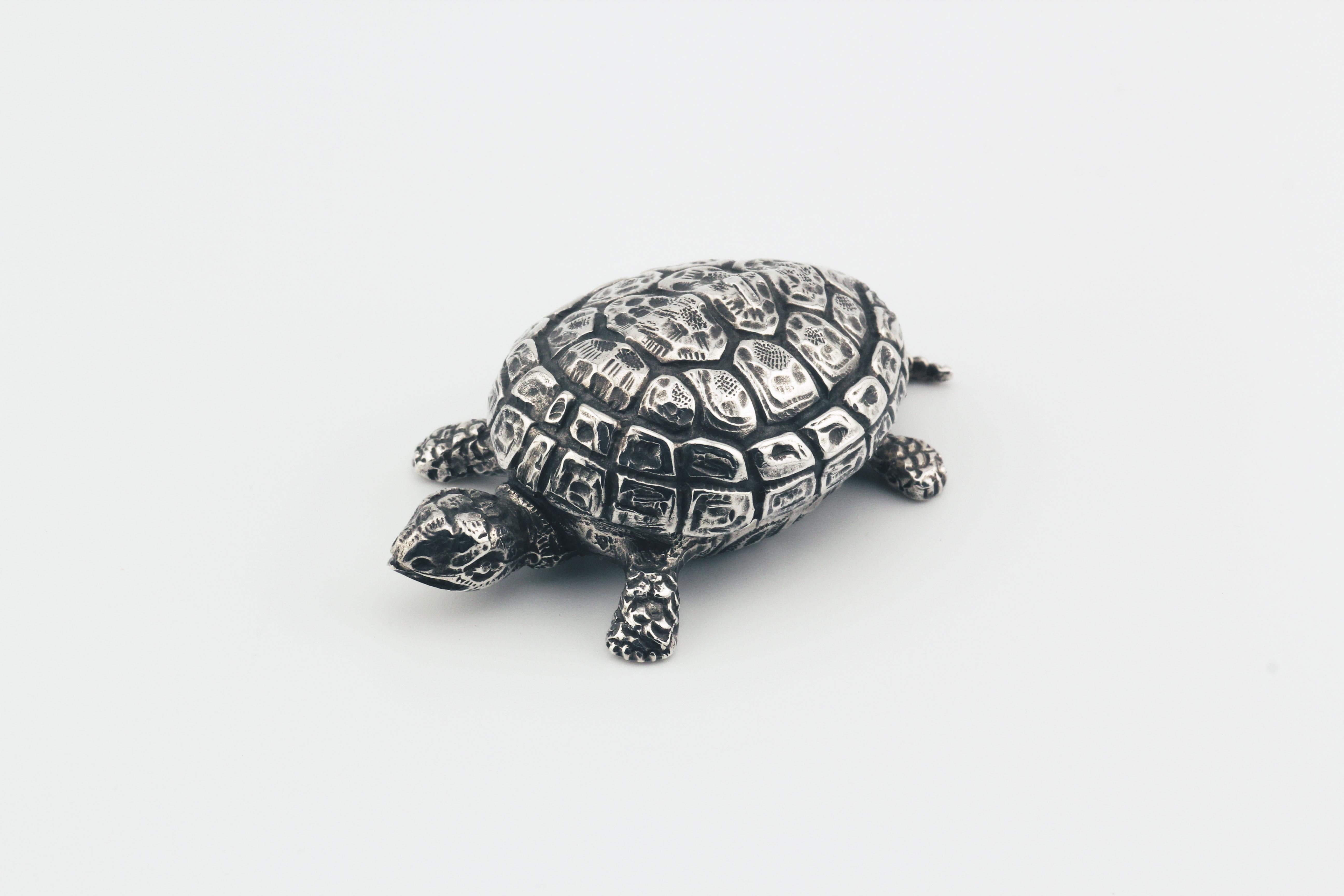 The Buccellati Rare Vintage Sterling Silver Turtle Small Pill Box is a beautifully crafted and unique collectible that embodies the exquisite artistry and meticulous craftsmanship for which Buccellati is renowned. Shaped like a turtle, this pill box
