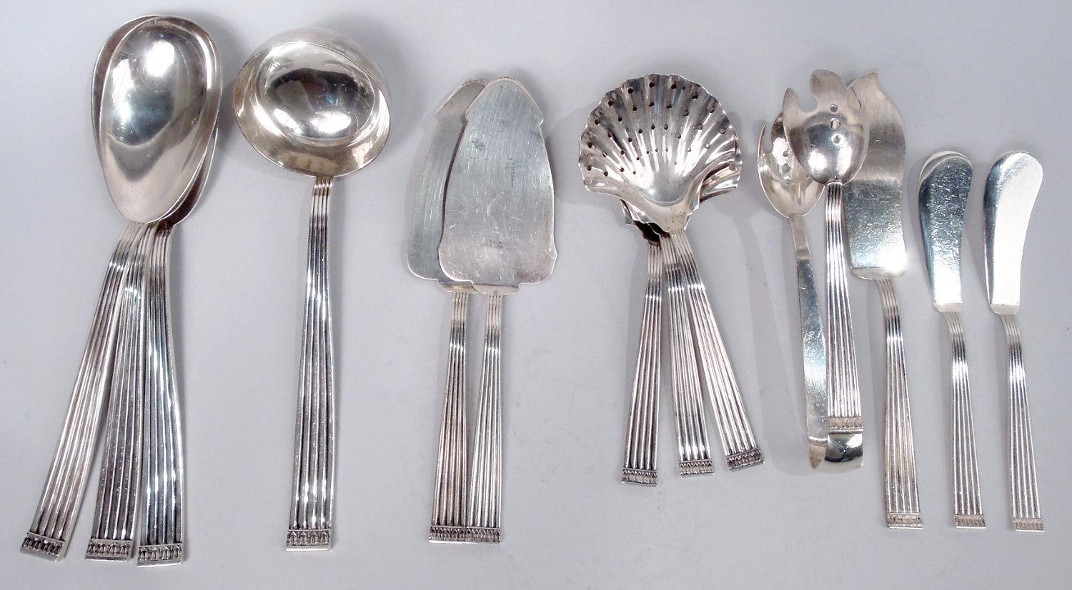 Rigato sterling silver dinner and lunch set for 24. Made by Buccellati in Italy. This set comprises 321 pieces (dimensions in inches):

Forks: 24 dinner forks (8), 24 luncheon forks (7 1/4), 24 fish forks (6 3/4), 24 salad forks (7), and 11 dessert