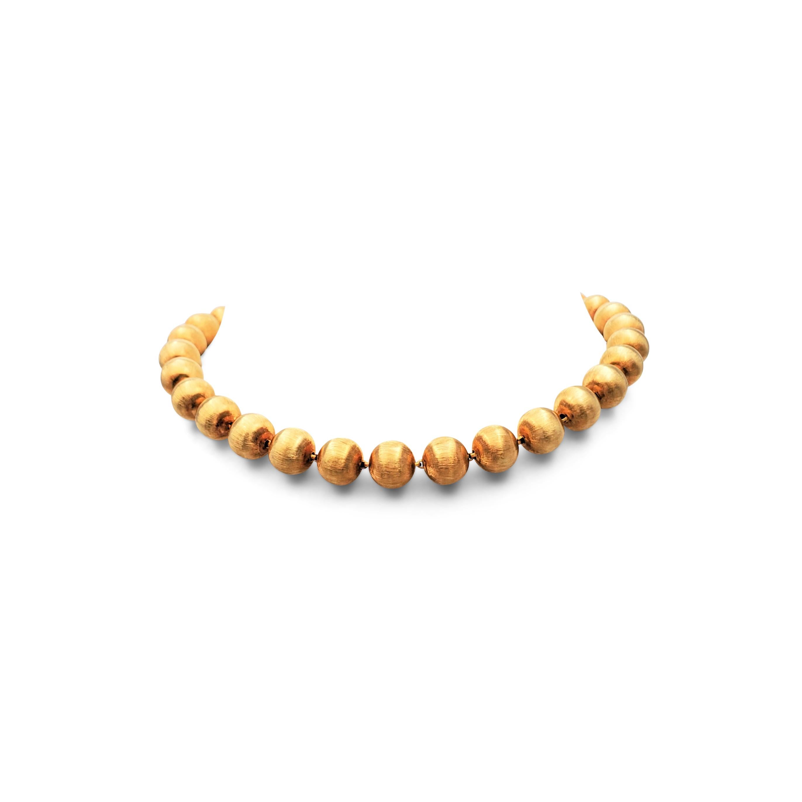 Authentic Buccellati 'Rigato' convertible necklace composed of 18 karat yellow gold beads with a lustrous florentine finish. Signed M. Buccellati, Italy, 750. The necklace converts into two bracelets measuring 8 1/2 inches and 9 3/4 inches