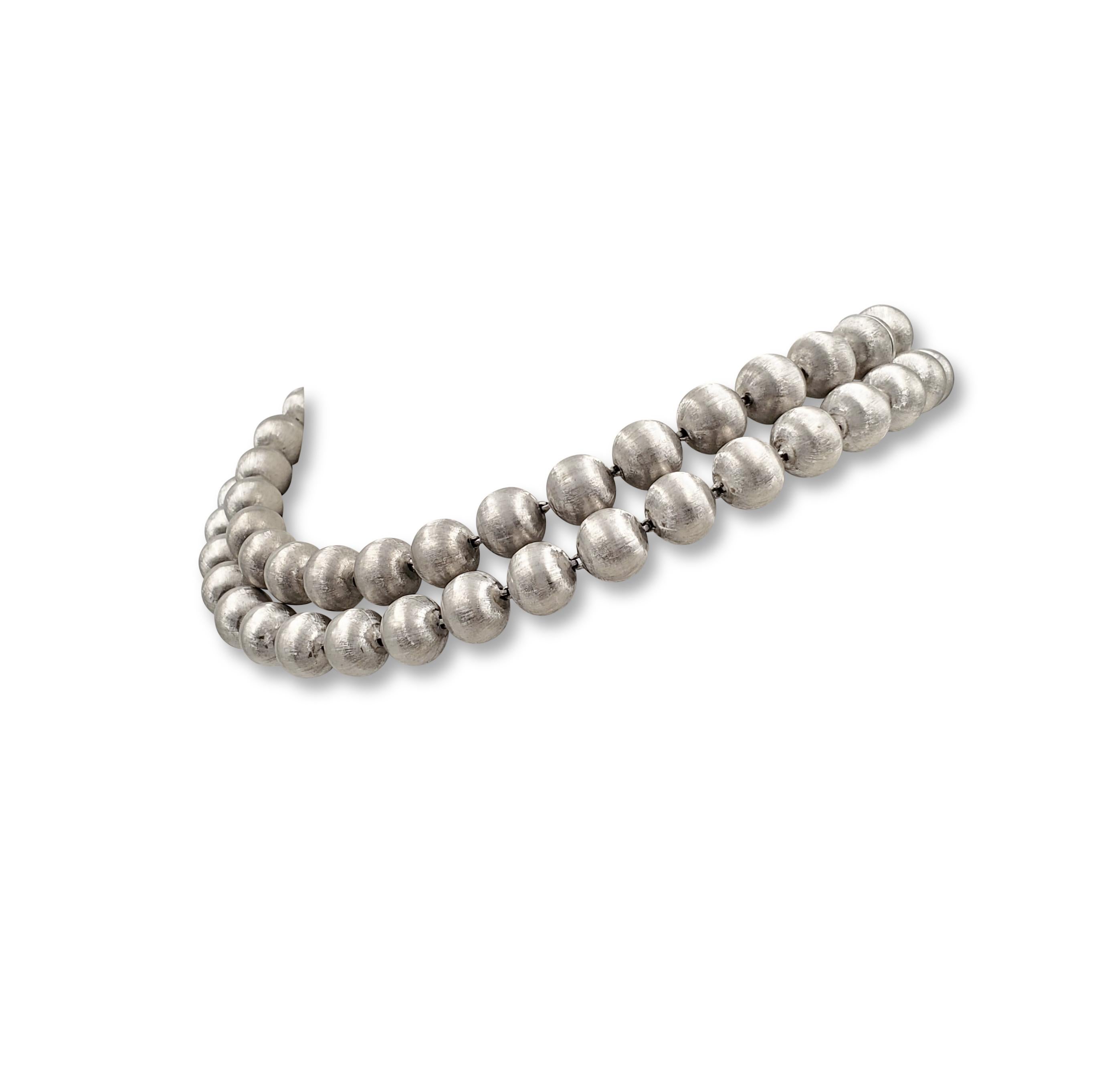 Authentic Buccellati 'Rigato' convertible necklace composed of 18 karat white gold beads with a lustrous florentine finish. The set can be worn as two necklaces measuring 18 1/2 inches and 16 1/2 inches separately or as one long necklace measuring
