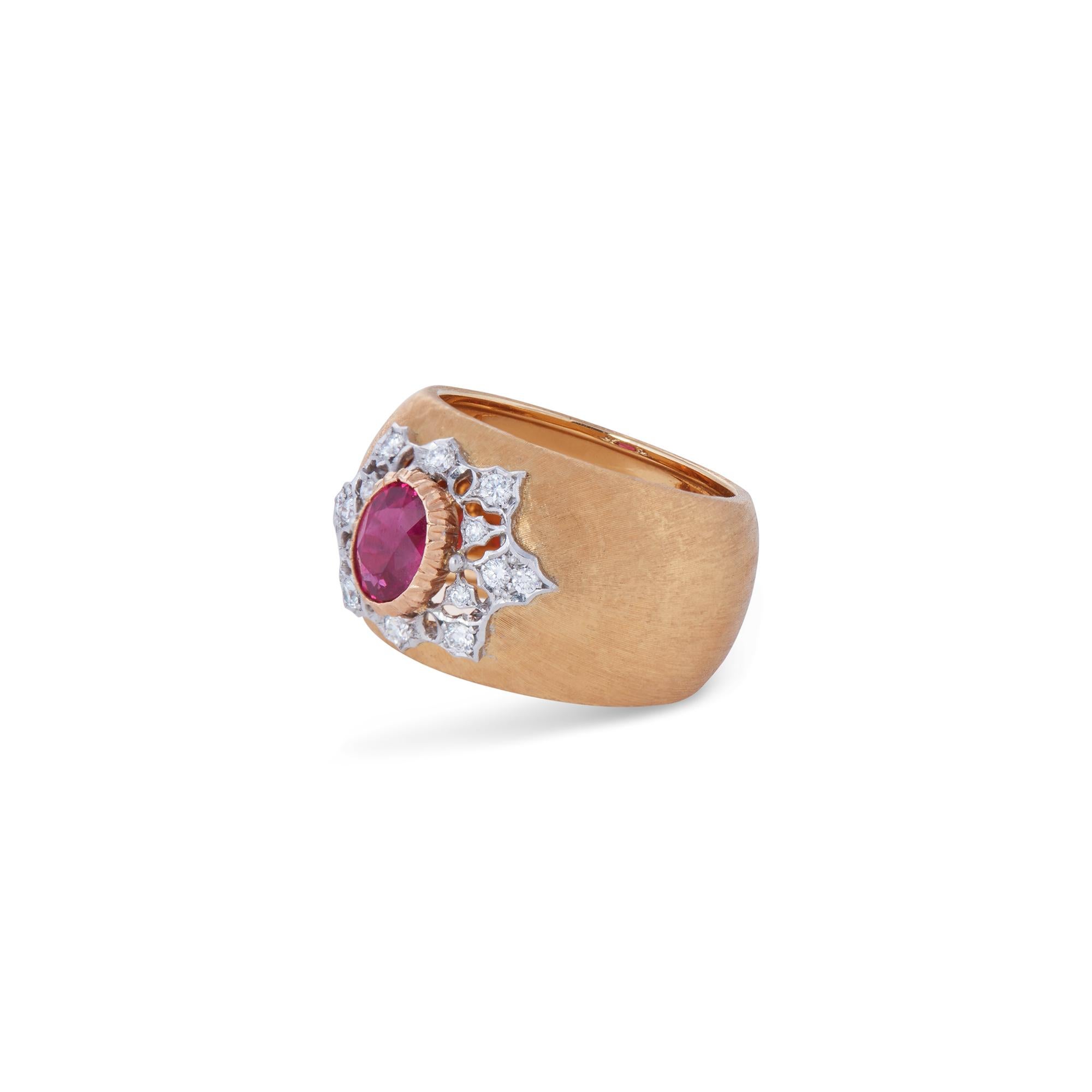 Authentic Buccellati premium band ring crafted in 18 karat brushed gold.  The ring features a captivating 1.05 carat oval faceted bezel set Burma ruby at the center surrounded by 0.21 carats of round brilliant cut diamonds set in an intricate white