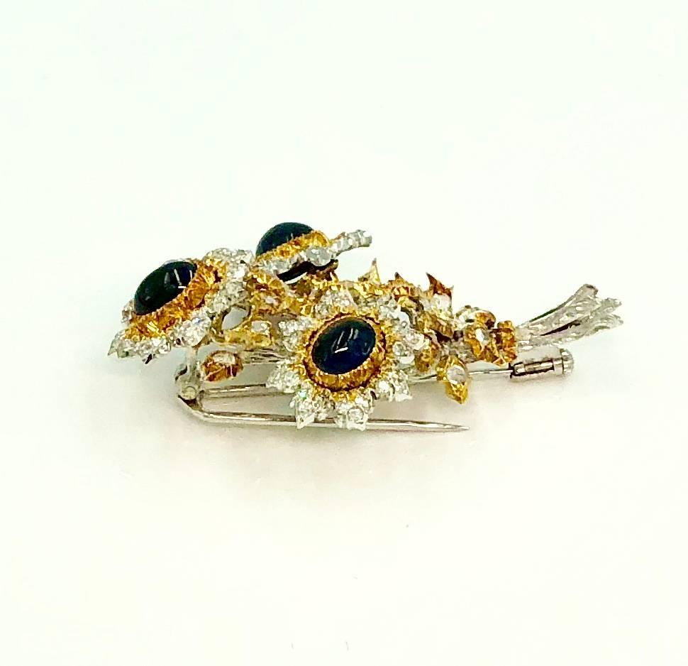 A raffinate brooch hand-made by the Italian goldsmith master Buccellati. This piece of jewelry represents three flowers composed by two cabochon sapphires. The petals and the leaves are embellished with diamonds.

3 Sapphires (3ct ca.), Diamonds 3ct