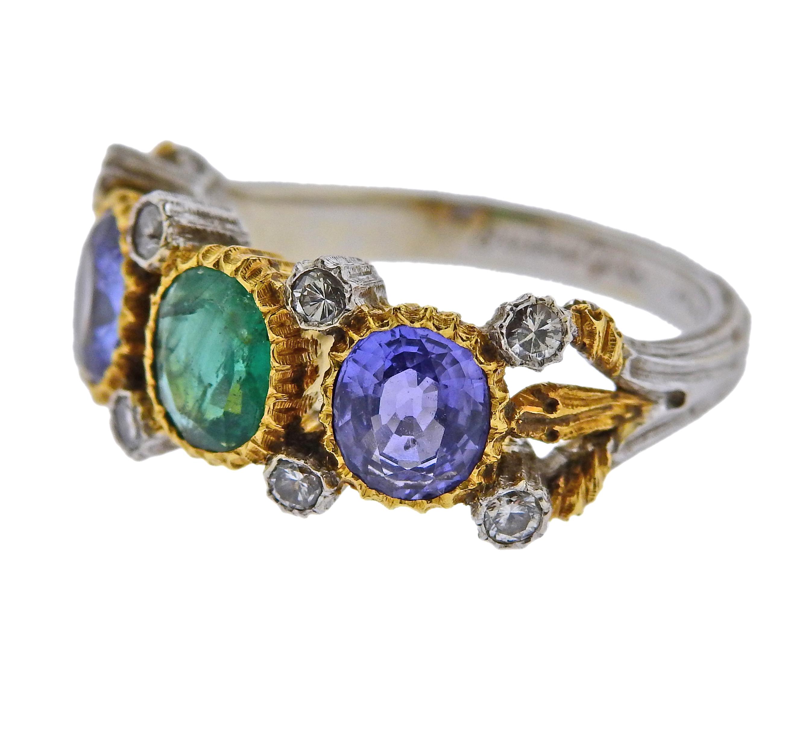 Vintage Buccellati ring, set in 18k yellow and white gold, featuring two sapphires (1.66ctw), one emerald( 0.62ct) and diamonds (0.29ctw). Comes wth original Buccellati receipt from 1989. Ring size is 6.5, ring top is 9mm wide. Weight is 5.6 grams.