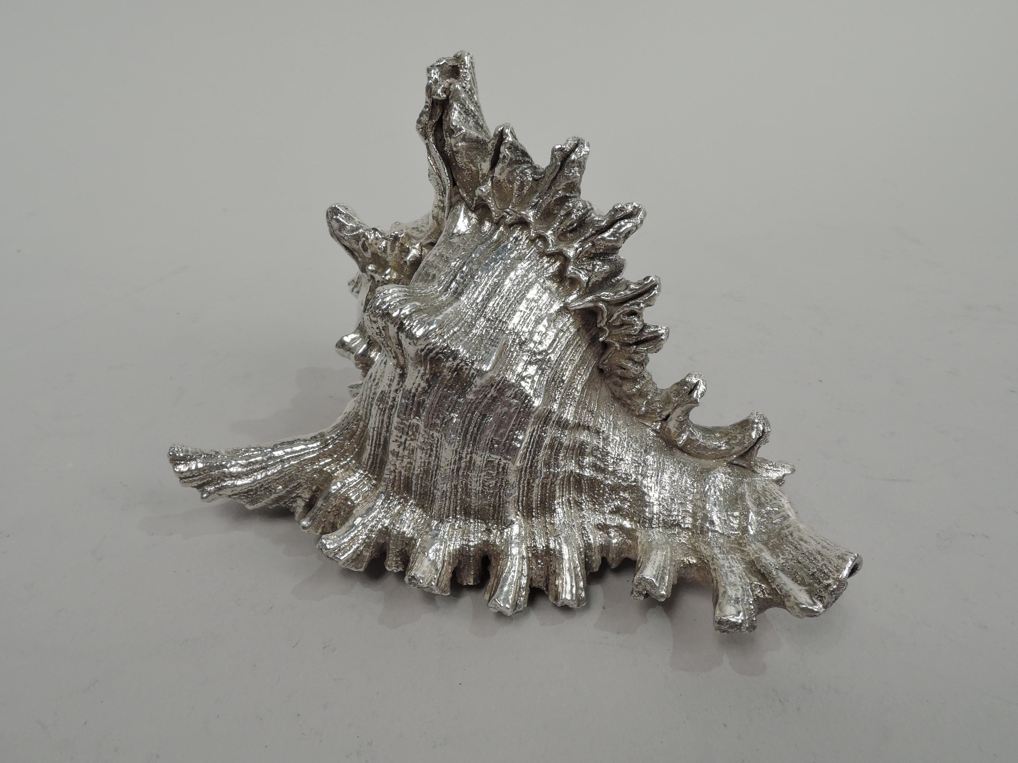 Italian silver cast figural seashell. Spiky, irregular, and striated conch, suggestive of a sea-tossed journey. Shell-lined interior. Marked “Federico Buccellati”, “999”, and post-1967 Italian mark. Gross weight: 9 troy ounces.