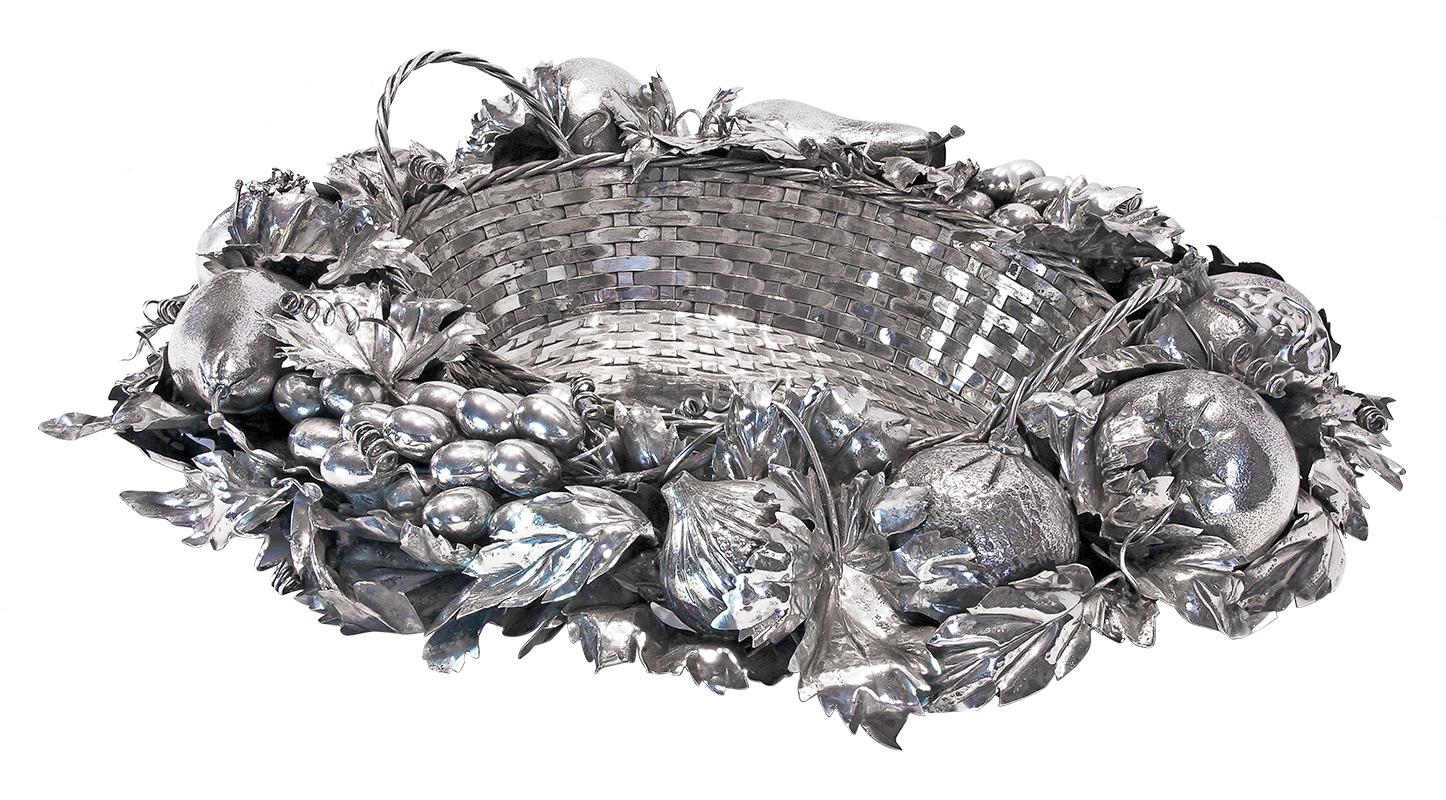 Buccellati silver fruit basket centerpiece in sterling silver.

Buccellati centerpiece oval shape measures approximate: 21 1/2? in length, 18? in width, 5 1/2? in height. Basket top diameter is 13? x 10? and tapers down to a bottom diameter of 11?