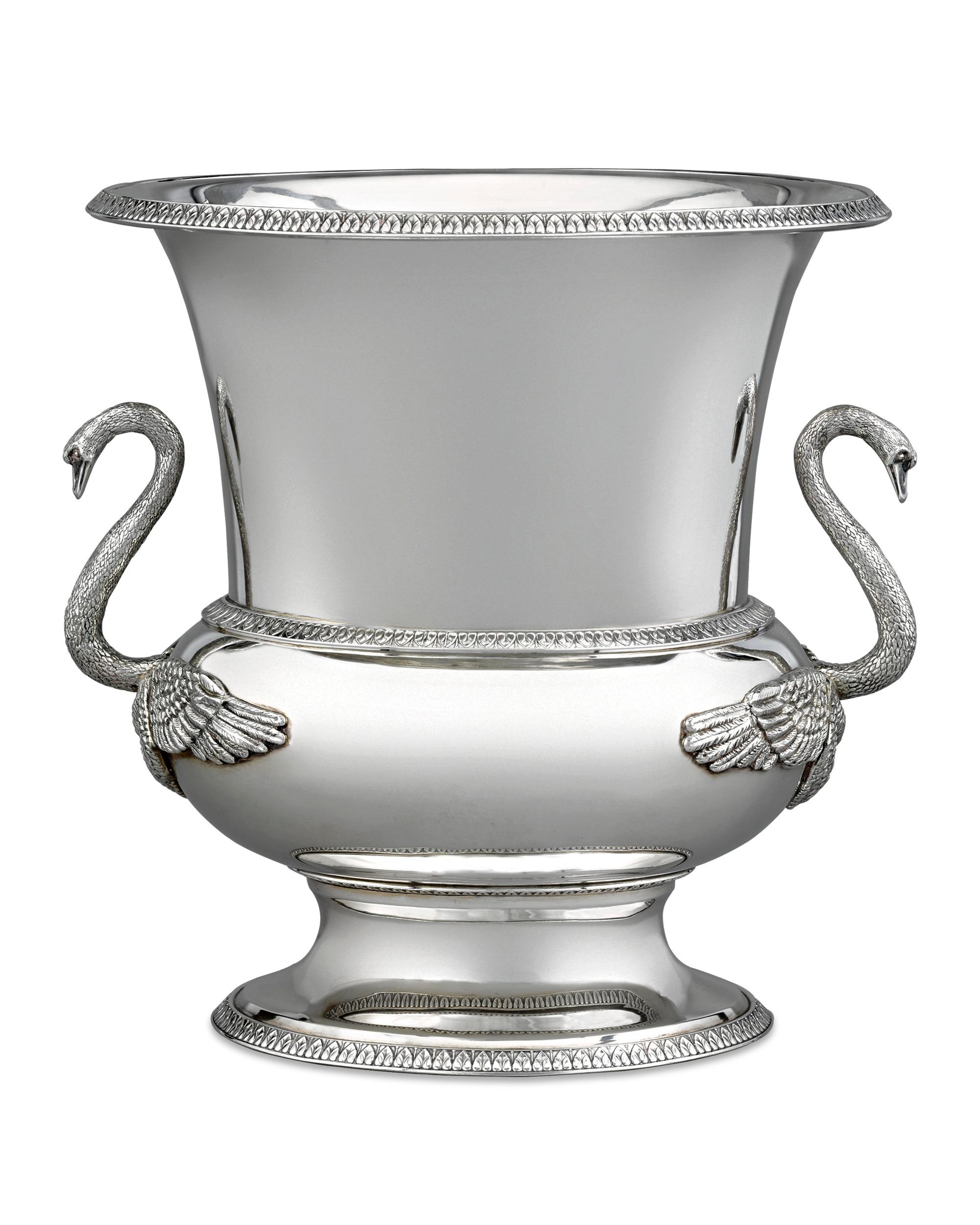 A refined interpretation of the ancient Greek calyx vase, this sterling silver wine cooler by Buccellati is a brilliant specimen of contemporary silversmithing. The most distinguishing feature is the pair of meticulously chased and engraved swans