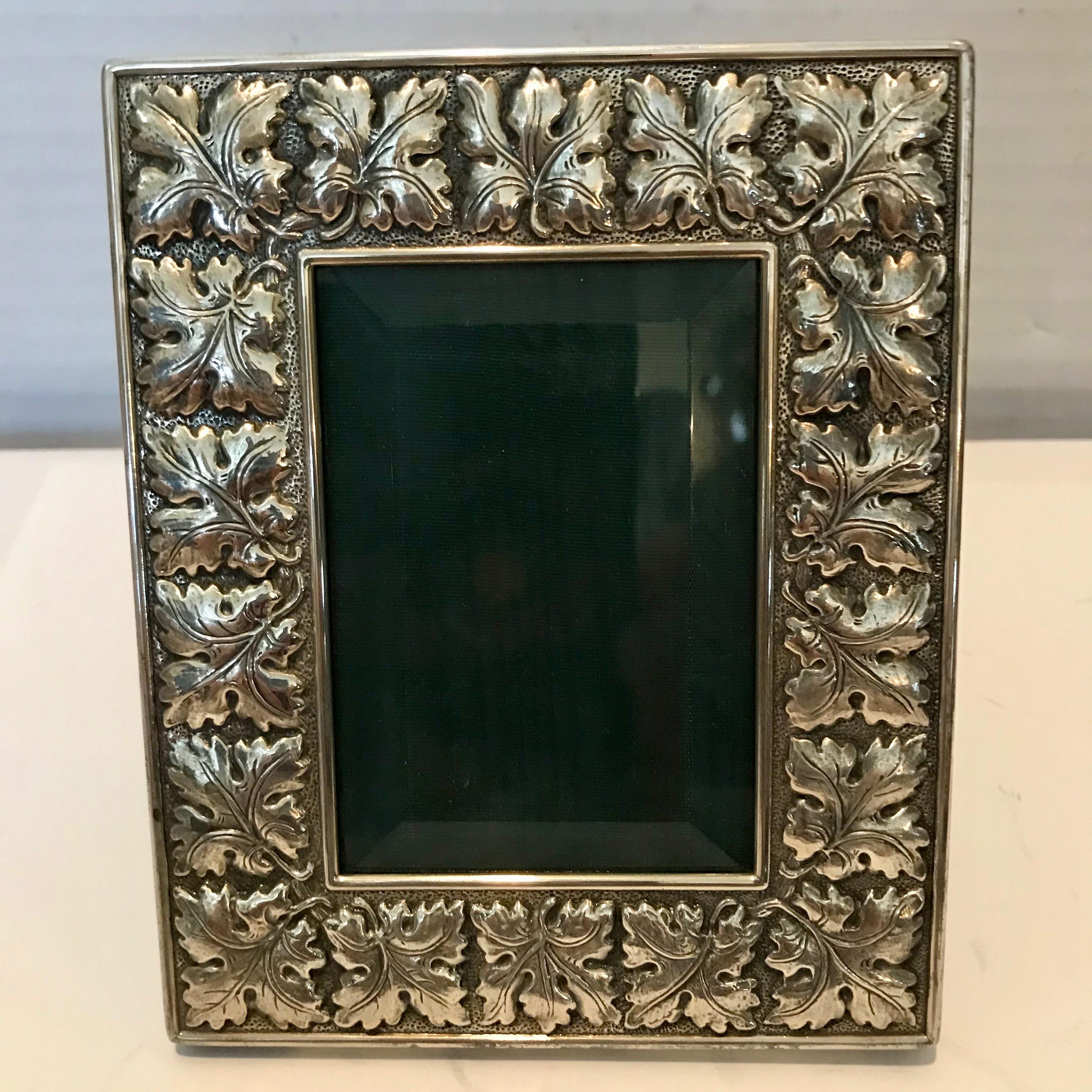 Leaf pattern by the iconic silversmith. Superior quality and workmanship.
The frame comes with original box ( worn ). The hand finished frame is unused
and in excellent condition with classic leather backing and beveled glass.