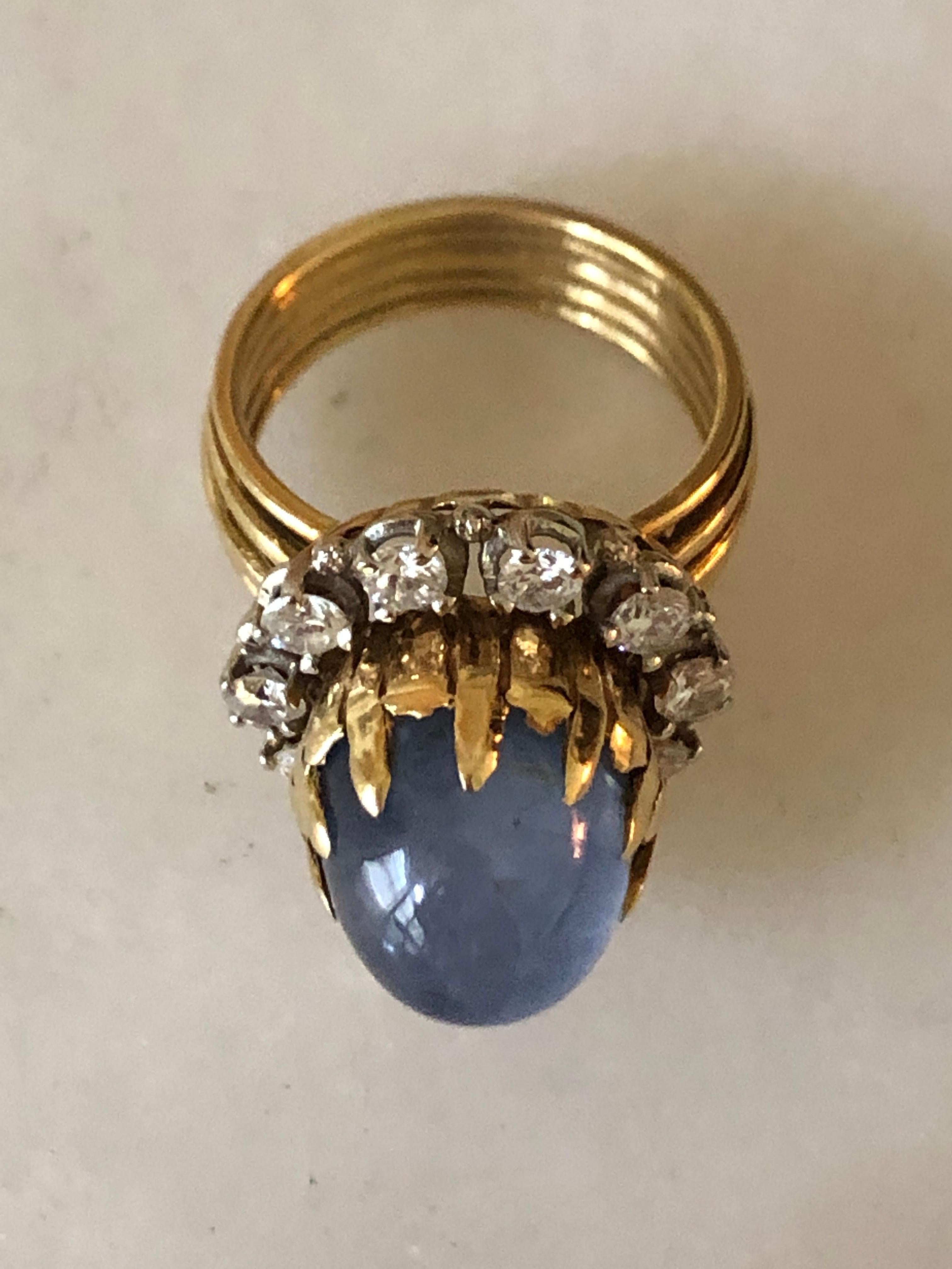 Buccellati-style star sapphire & diamond ring, Made in Italy

Buccellati-style ring is in 18 karat yellow gold with large central star sapphire surrounded by ten round brilliant diamonds. The ring bears impressed touch marks for 18 karat gold and