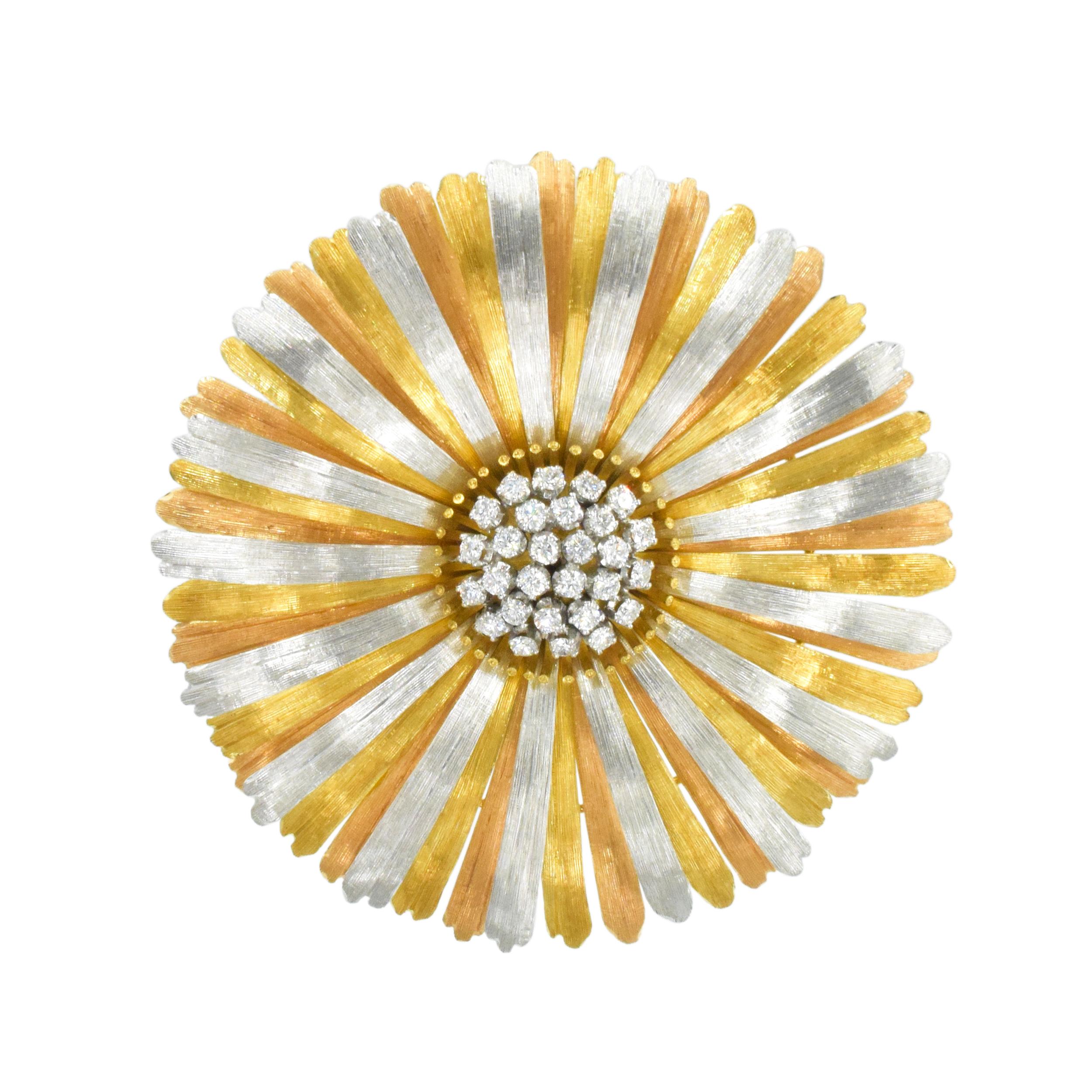 Buccellati Three-Color Gold and Diamond Brooch This brooch is designed as a flower, with yellow, white and pink 18k gold petals with beautiful textured finish. The center set with twenty eight round diamonds weighing 0.85ct, Color: G-H, Clarity: VS.