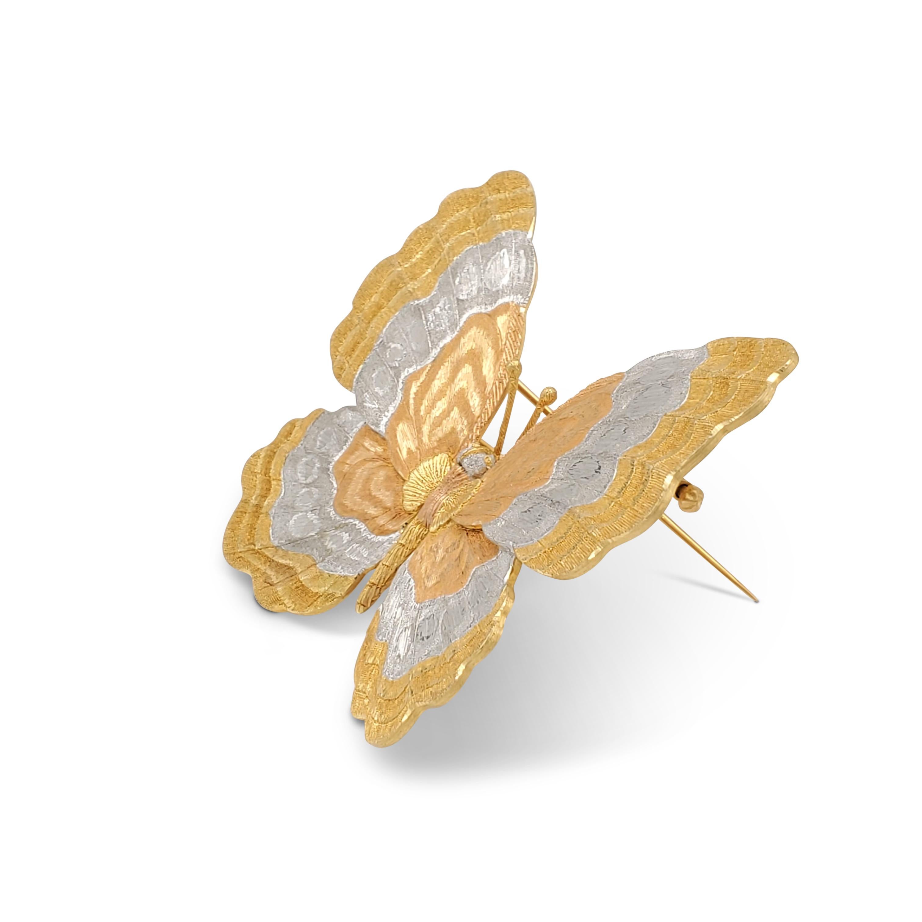 A stunning Buccellati brooch crafted in 18 karat yellow, rose, and white gold.  The intricate butterfly design comes to life in the exquisitely brushed pattern of the wings.  The brooch measures 2 1/4 inches in length and 2 1/4 inches at the widest
