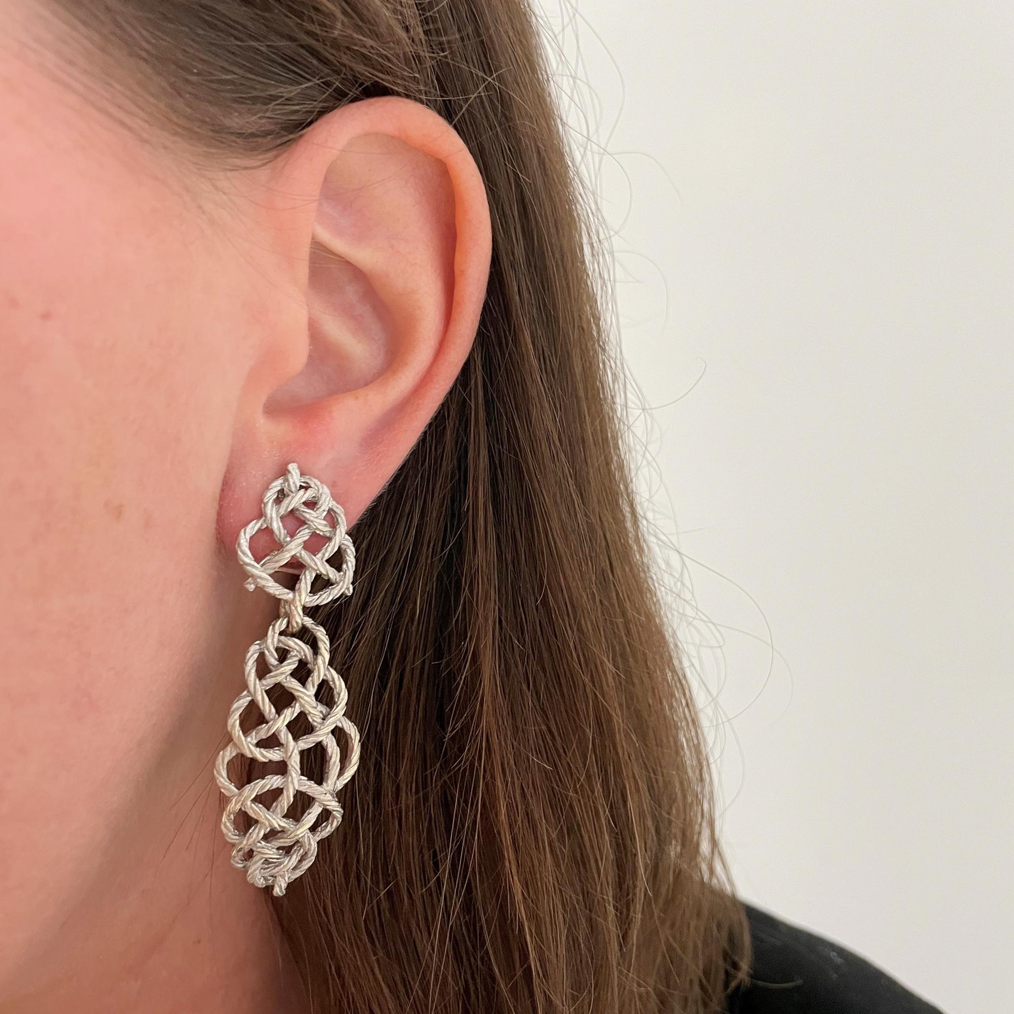 These Buccellati Crepe De Chine earrings feature a twist motif in 18K white gold with detachable pendants. Post and clip backs. 22 signed Buccellati Italy.

Tops 1 x 11/16 inch.
With pendants 2 3/8 x 13/16 inches.

