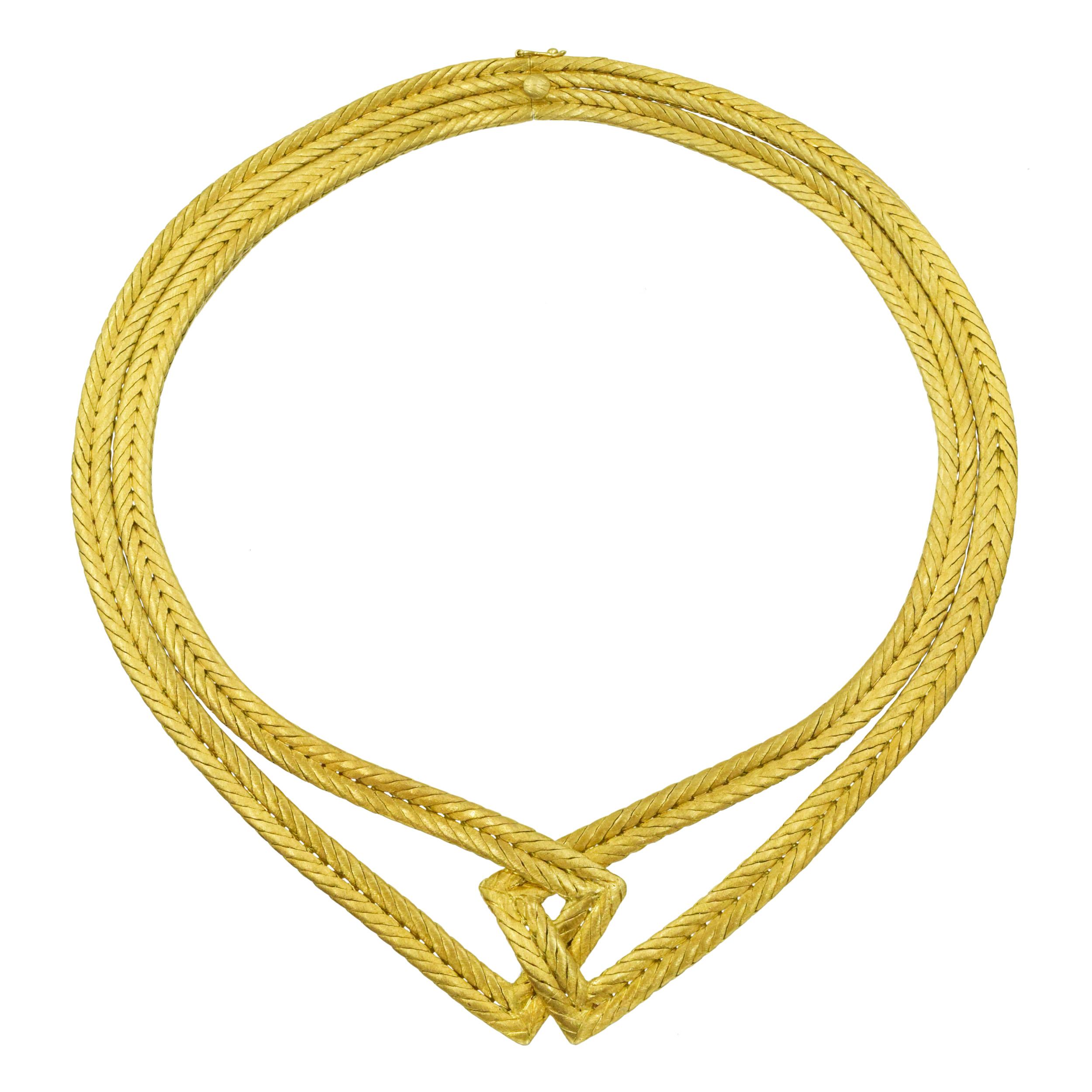 Buccellati woven choker necklace in 18k yellow gold. The necklace consists of two woven design strands interlocked at the center. Featuring iconic Buccellati brushed gold finish. Equipped with box clasp and fold over safety lock. Inscribed: