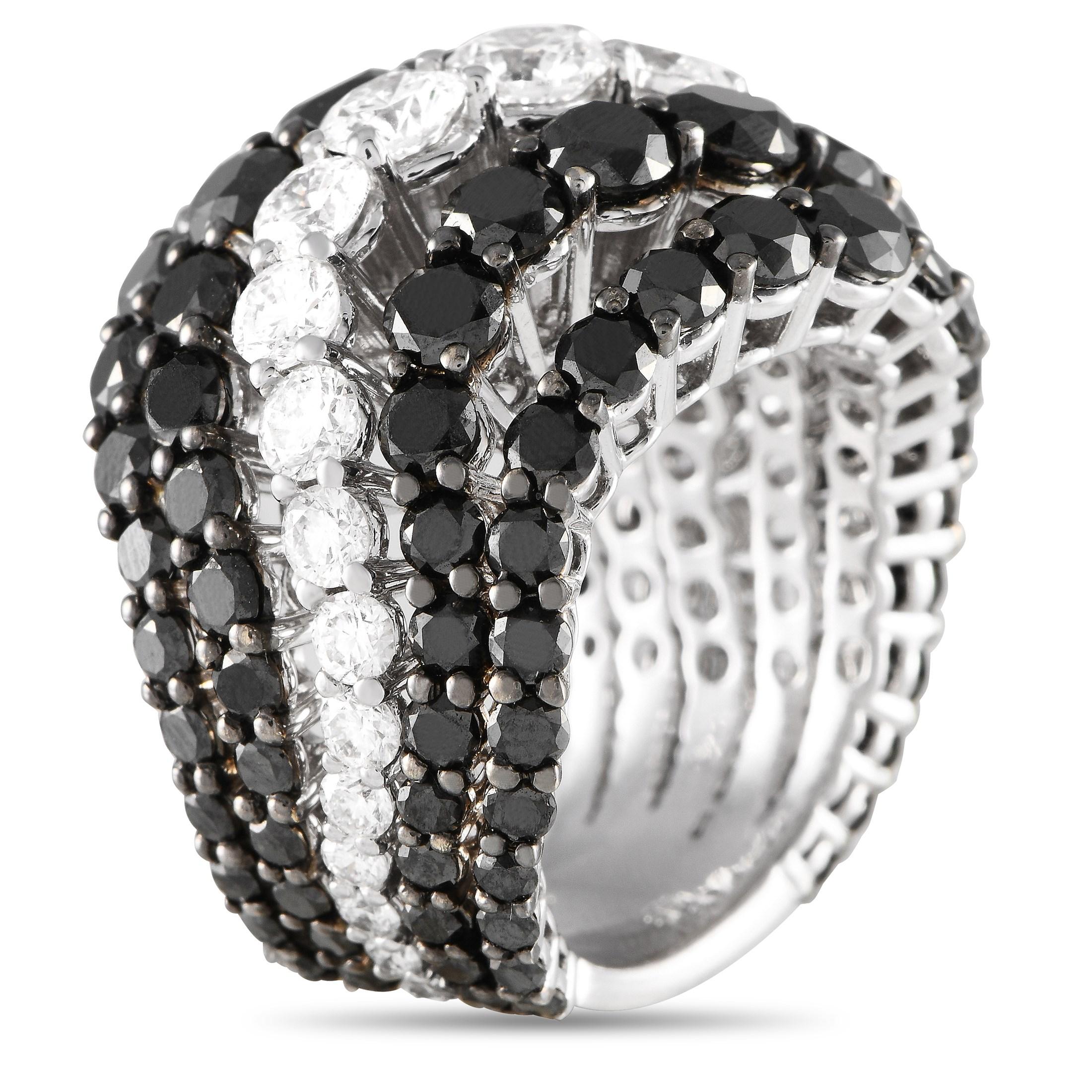 A stunning array of diamonds makes this Bucherer ring simply unforgettable. Alternating bands of black diamonds totaling 8.20 carats and white diamonds totaling 2.66 carats are only elevated by the curved lines in the 18K white gold setting. This