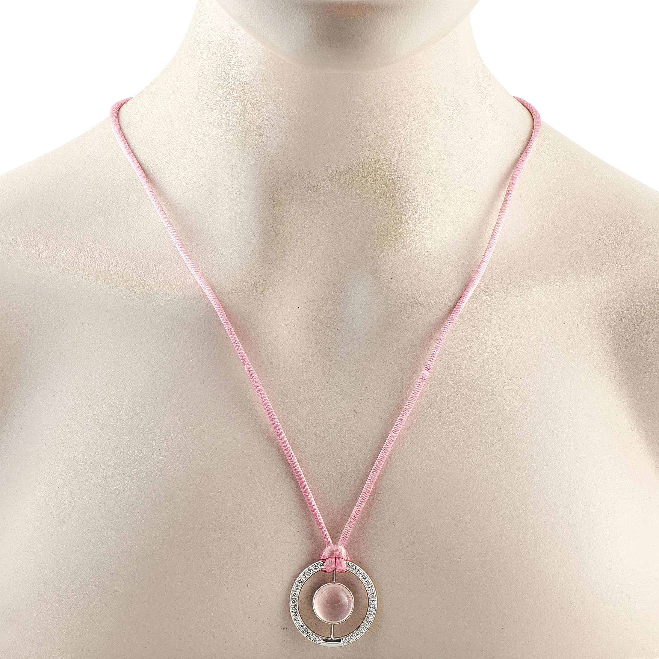This Bucherer necklace is simply unforgettable. Perfect for anyone who loves the color pink, a stunning Rose Quartz gemstone is suspended at the center of a circular 18K White Gold pendant. The pendant measures 1.19 round and includes inset Diamonds