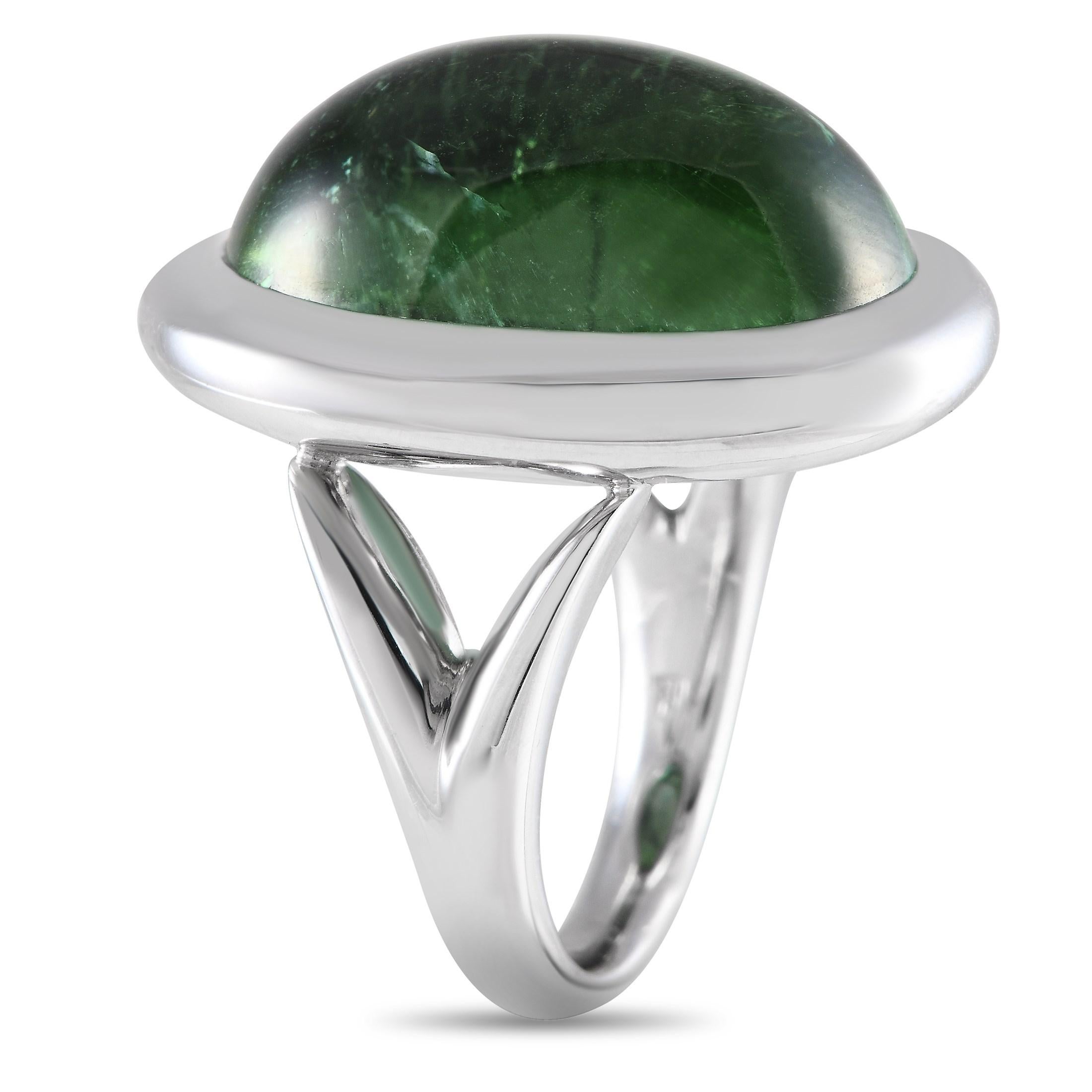 An eye-catching 25.69 carat tourmaline gemstone makes a statement at the center of this impressive Bucherer ring. A minimalist piece that will complement any aesthetic, this pieces 18K white gold setting features a 2mm wide band and an 11mm top