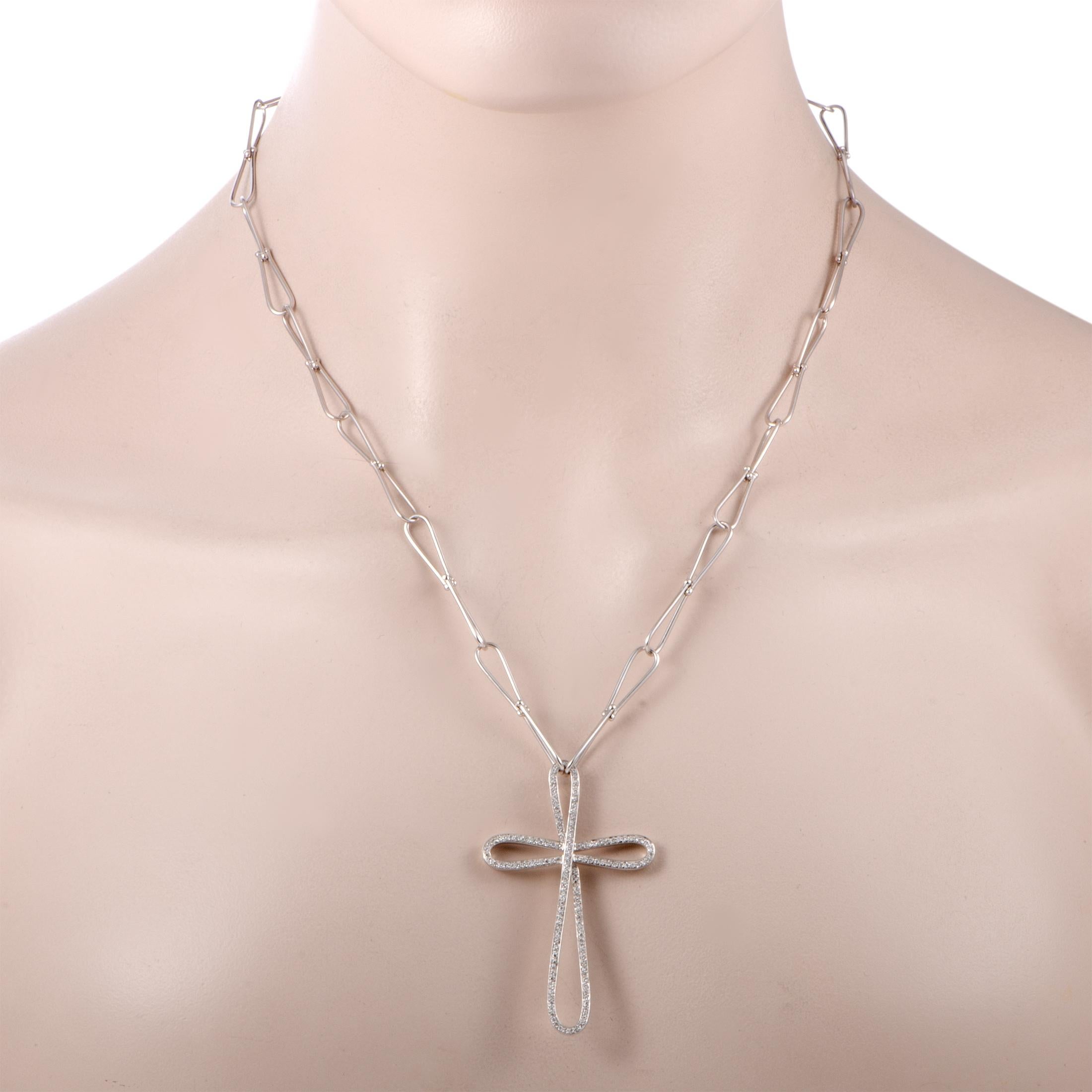 Carrying astonishing symbolic significance as well as enticing aesthetic value, the alluring motif of a cross is presented in a slightly unusual, gracefully smooth, and marvelously lavish fashion in this majestic necklace from Bucherer. Crafted from