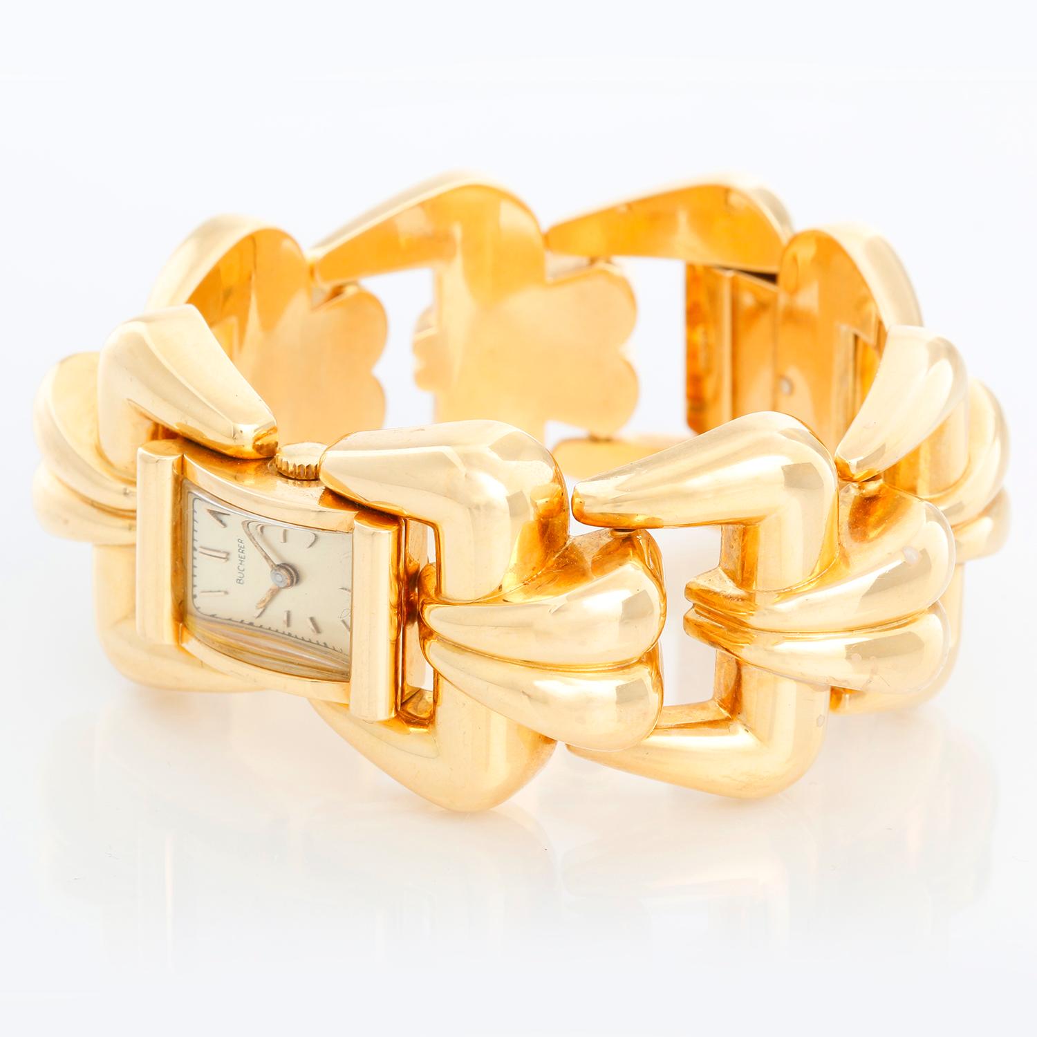 Bucherer 18K Yellow Gold Ladies Wristwatch - Manual winding. 18K Yellow gold rectangular case ( 15 x 23 ). Silver dial with stick hour markers. 18K Yellow gold lobed links; will fit a 6 1/2 inch wrist. Pre-owned with custom box; Circa 1940's .
