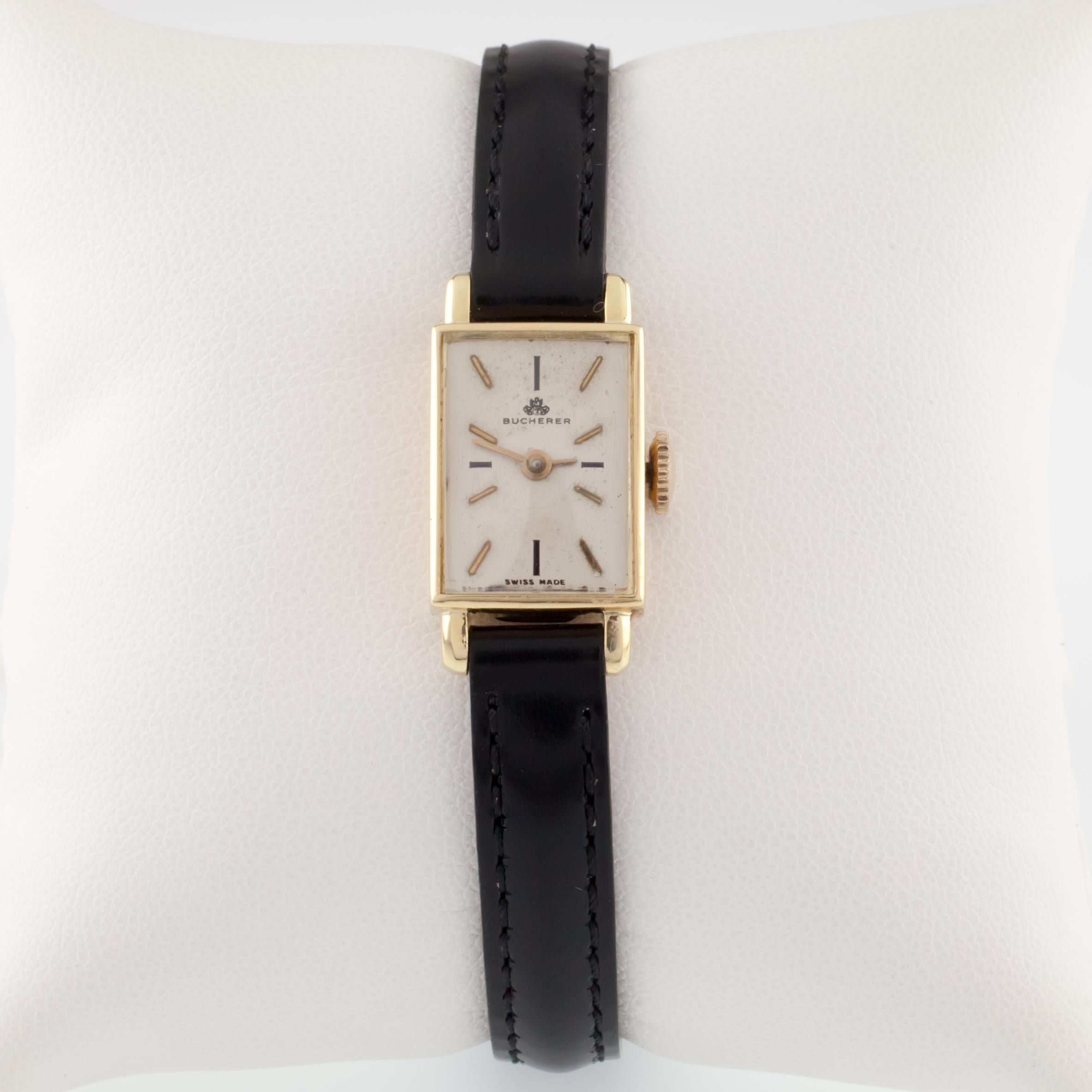 Bucherer 18k Yellow Gold Women's Hand-Winding Watch w/ Leather Band
Movement #6650
Case #4306T

18k Yellow Gold Rectangular Case
13 mm Wide (15 mm w/ Crown)
Lug-to-Lug Distance = 25 mm
Lug-to-Lug Width = 8 mm

Beige Dial w/ Gold Tic Marks and Hands