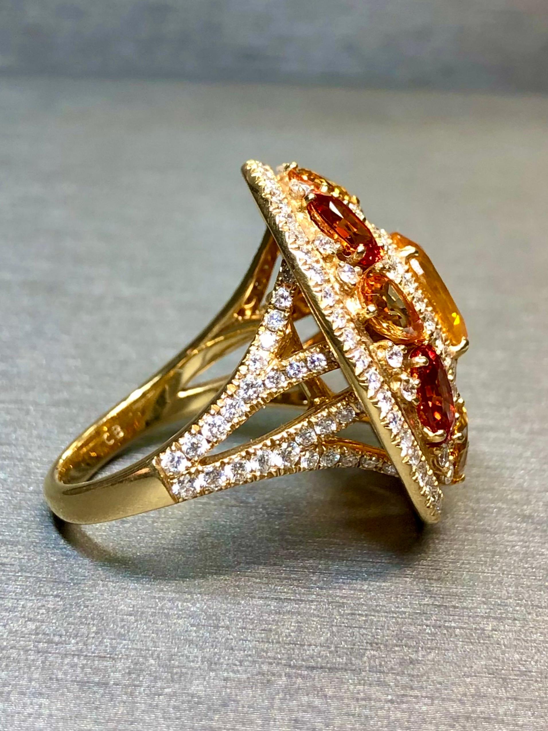 
A stunning cocktail by Carl Bucherer done in 18K yellow gold and centered by a natural yellow sapphire weighing approximately 2.30ct surrounded by another 5.50ctw in orange and yellow oval a pear sapphires. Set throughout the ring is another
