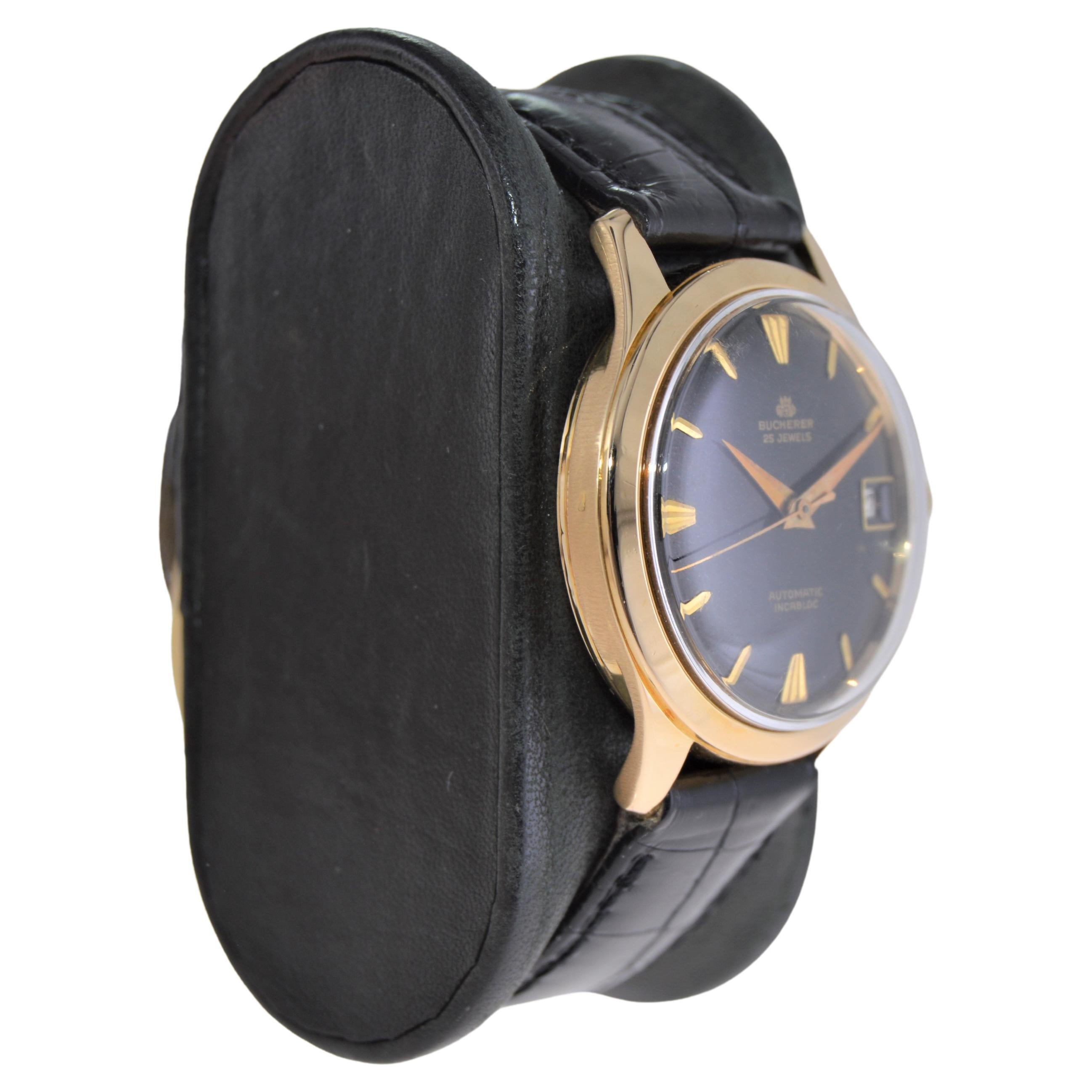 FACTORY / HOUSE: Bucherer 
STYLE / REFERENCE: Art Deco / Round 
METAL / MATERIAL: 18Kt.  Yellow Gold 
CIRCA / YEAR: 1950's
DIMENSIONS / SIZE: Length 40mm X Diameter 33mm
MOVEMENT / CALIBER: Manual Winding / 25 Jewels  
DIAL / HANDS: Original Black