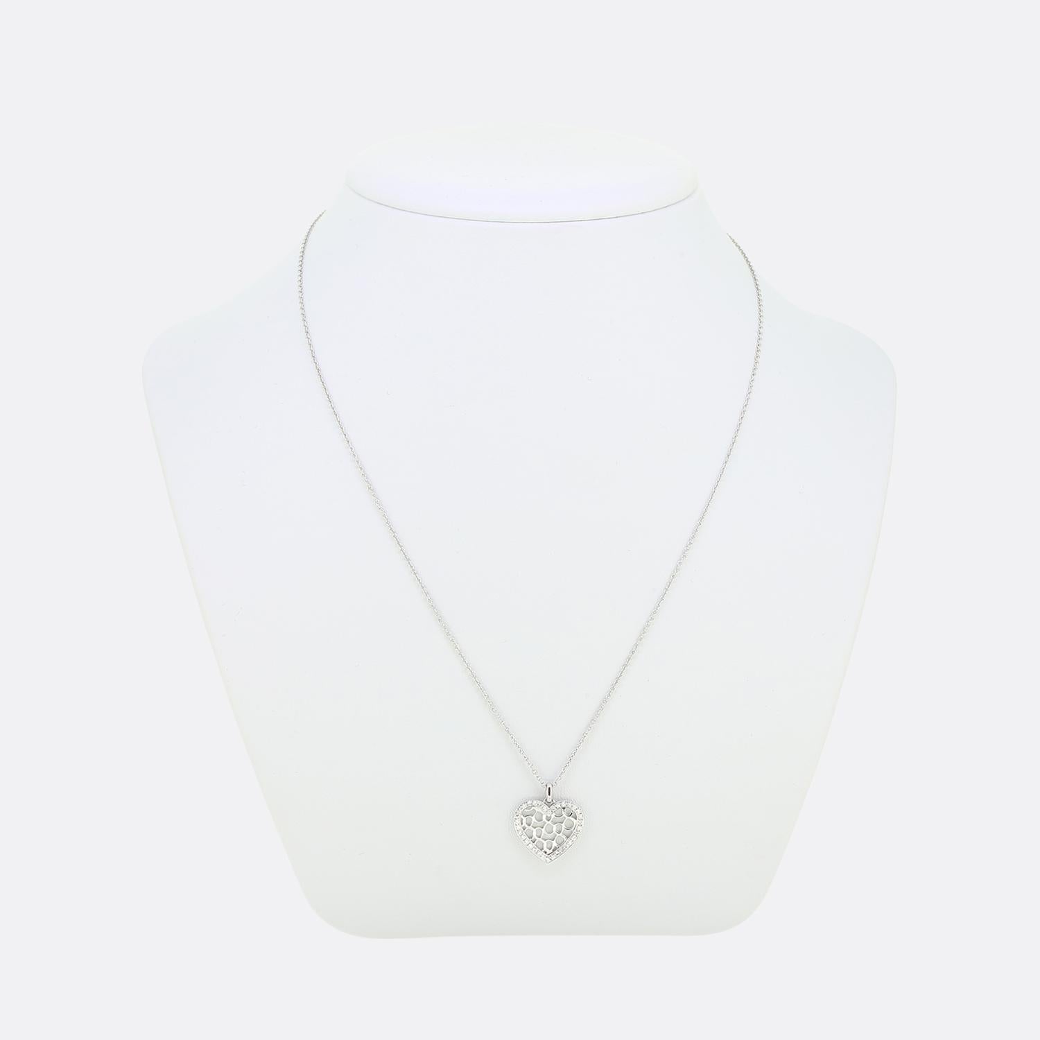 Here we have a wonderful diamond necklace from Bucherer. This piece has been crafted from 18ct white gold and showcases a love heart design with multiple openings at the centre. This romantic pendant is then accentuated by a frame of round brilliant