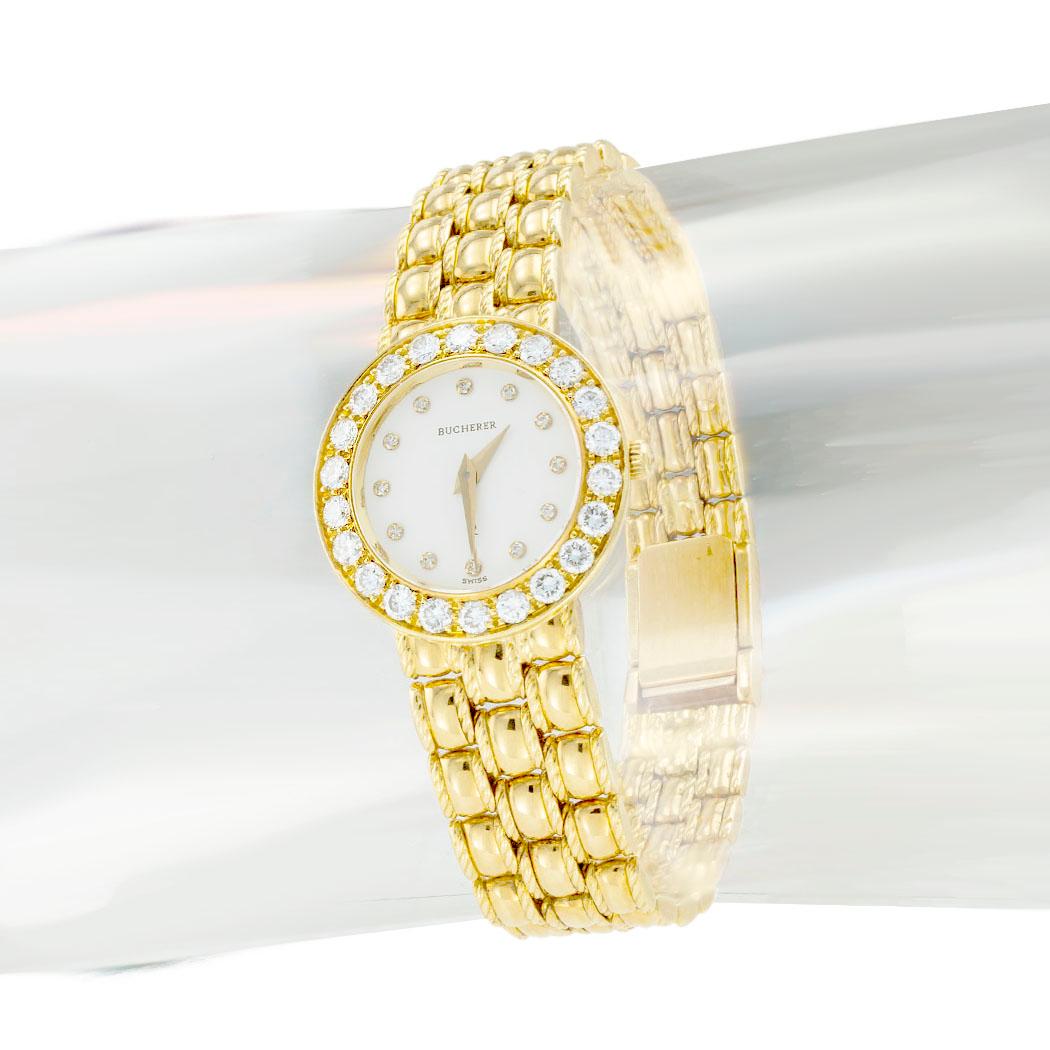 Bucherer diamond and yellow gold lady’s wristwatch circa 1980.  

SPECIFICATIONS:

MOVEMENT:  quartz movement, does not need winding.

DIAMONDS:  thirty-four round brilliant-cut diamonds totaling approximately 1.25 carats, approximately F-G color,