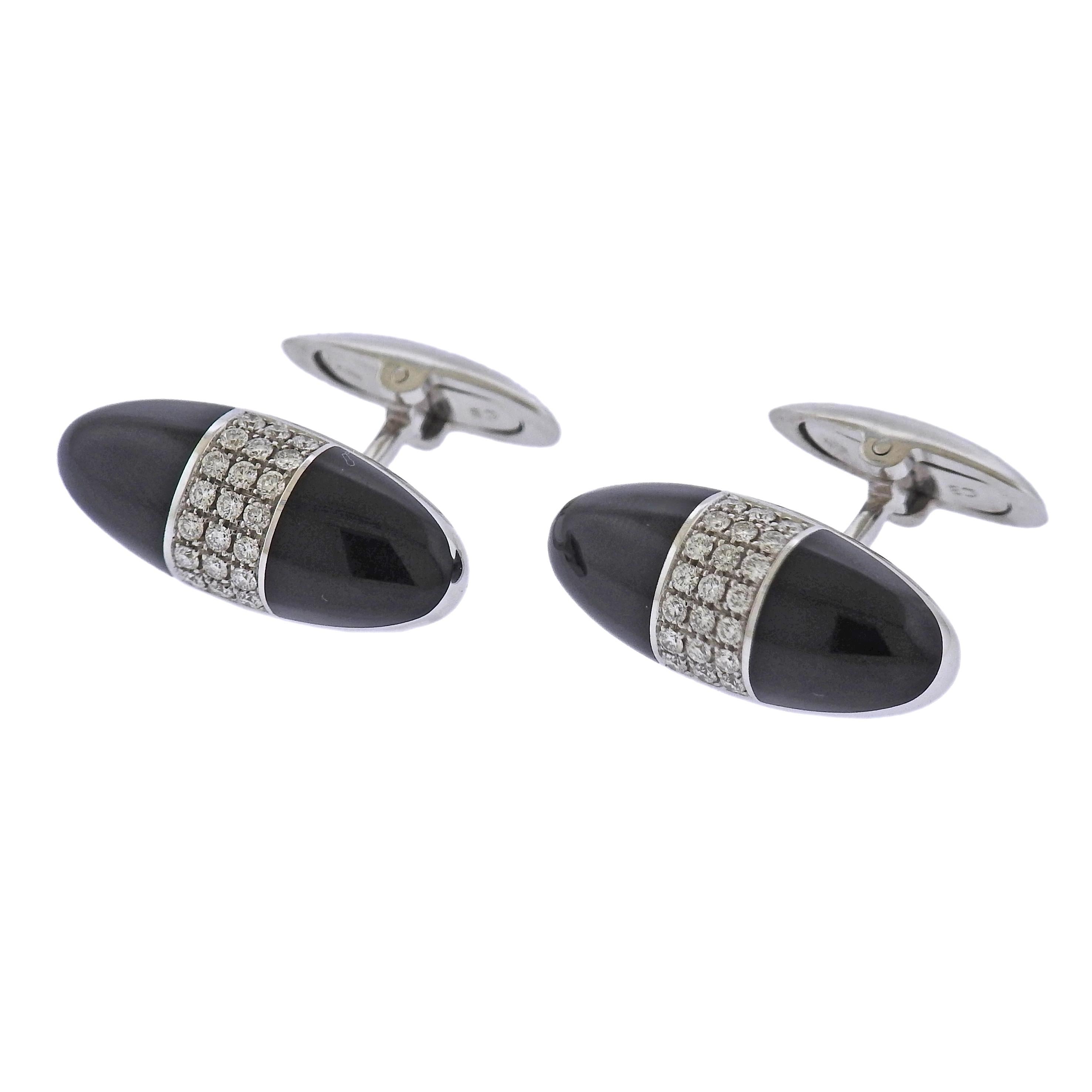 Brand new with tag Bucherer cufflinks, in 18k gold with 0.50ctw SI/H diamonds and onyx. Cufflink top measures 24mm x 10mm. Weight: 13.5 grams. Marked: CB,750. Retail Price $6100. Comes with box.